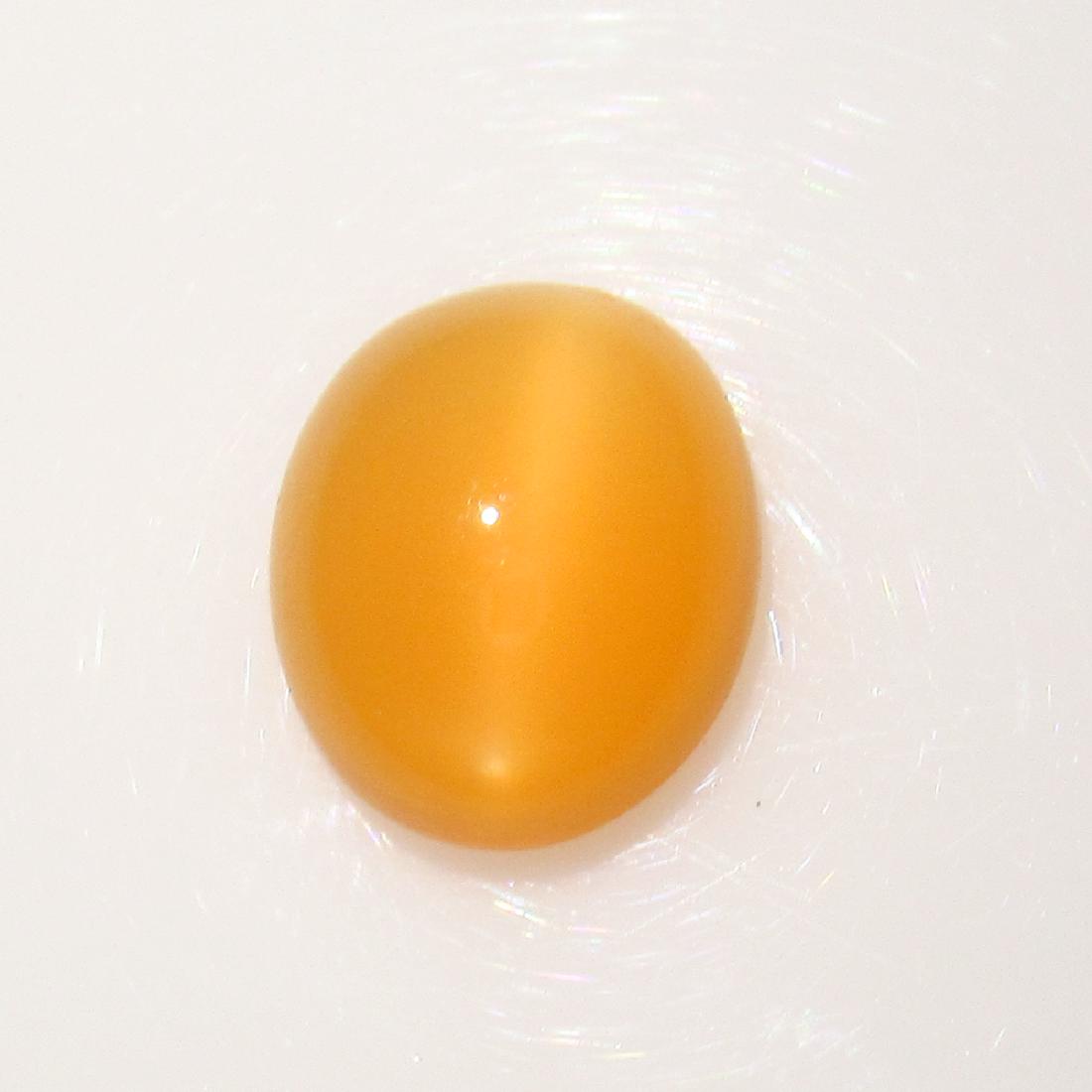 5.07 Ctw Natural Orange Moonstone Catseye Oval Cab: No Reserve! Title: 5.07 Ctw Natural Orange Moonstone Catseye Oval Cab Stone Clarity: Transparent Gemstones: Moonstone Catseye Carat Weights: 5.07 Size/Dimensions: 12.70 x 10.60 x 5.50 mm Additional In