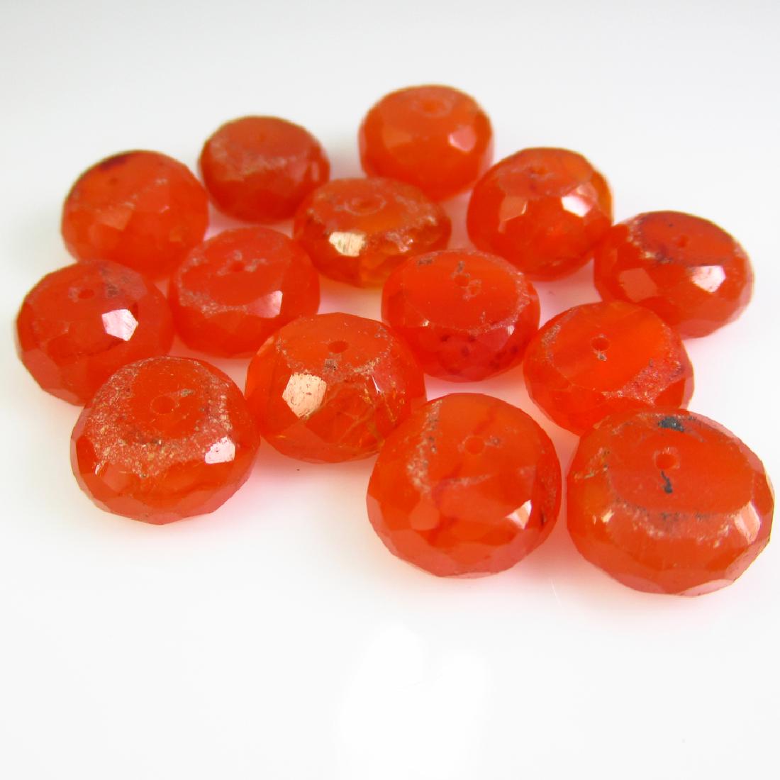 62.72 Ctw Natural 14 Carnelian Drilled Round Beads: No Reserve! Title: 62.72 Ctw Natural 14 Carnelian Drilled Round Beads Stone Clarity: Transparent Gemstones: Carnelian Beads Carat Weights: 62.72 Size/Dimensions: 9.70 x 6.50 to 11.20 x 4.90 mm / 14 PC