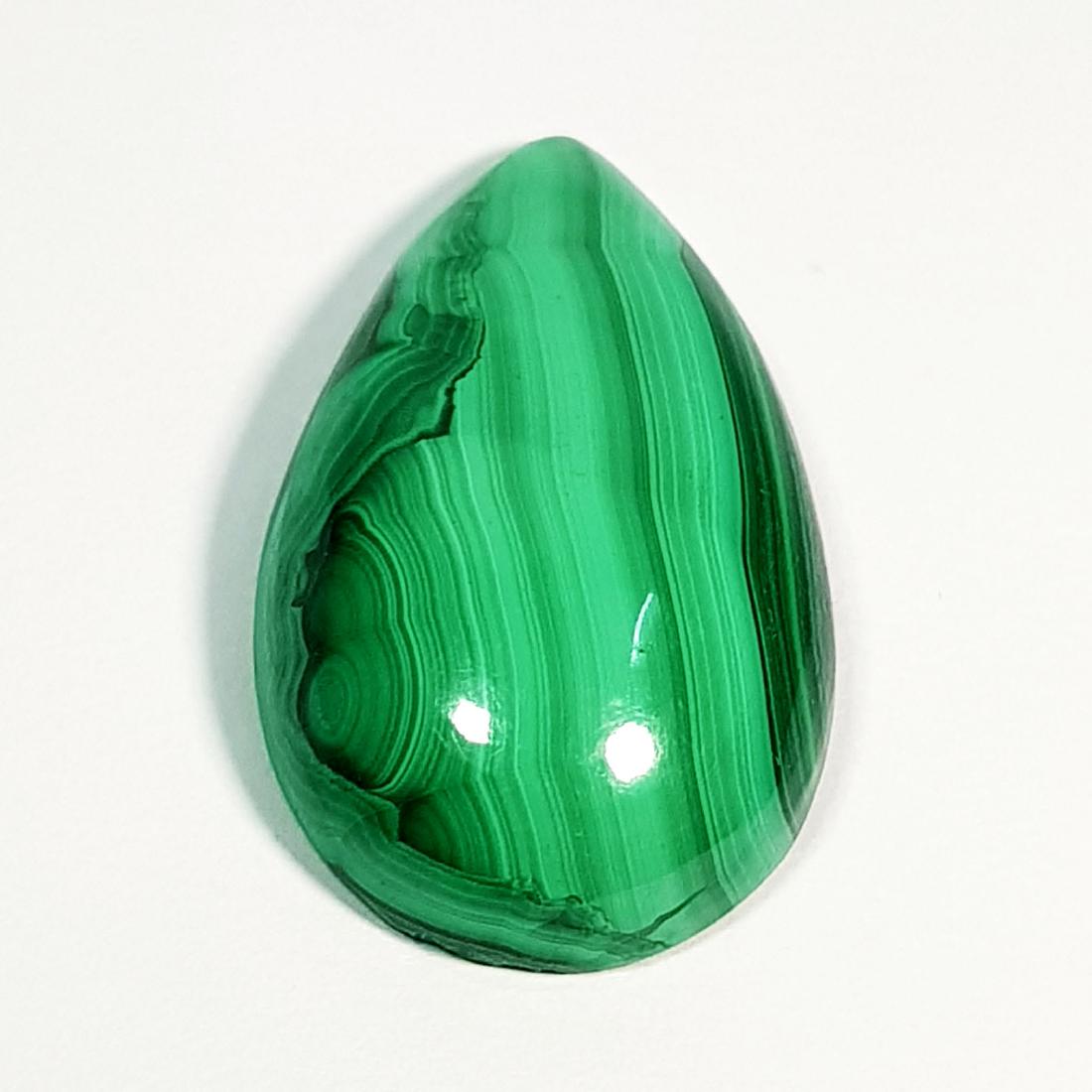 38.25 ct Natural Malachite: No Reserve! Title: 38.25 ct Natural Malachite Color/Clarity: Opaque Gemstones Carat Weights: 38.25 Size (mm): 30.00 x 17.20 x 7.75 Pear - Africa Shipping: Worldwide: Flat-rate of $10.00 to anywhere in