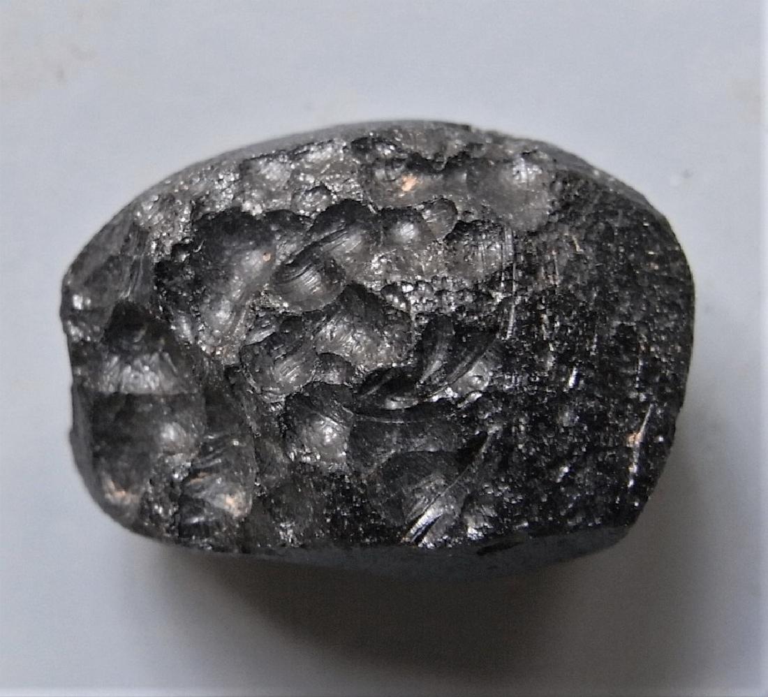 THAILANDITE TEKTITE - FROM METEORITE IMPACT: Title: THAILANDITE TEKTITE - FROM METEORITE IMPACT Origin: Noen Sa-nga, Chaiyaphum Prov. Thailand Size: 2x1.5x1.3 cm / 5 gram Description: thailandite tektite. one side round other concave. small glas