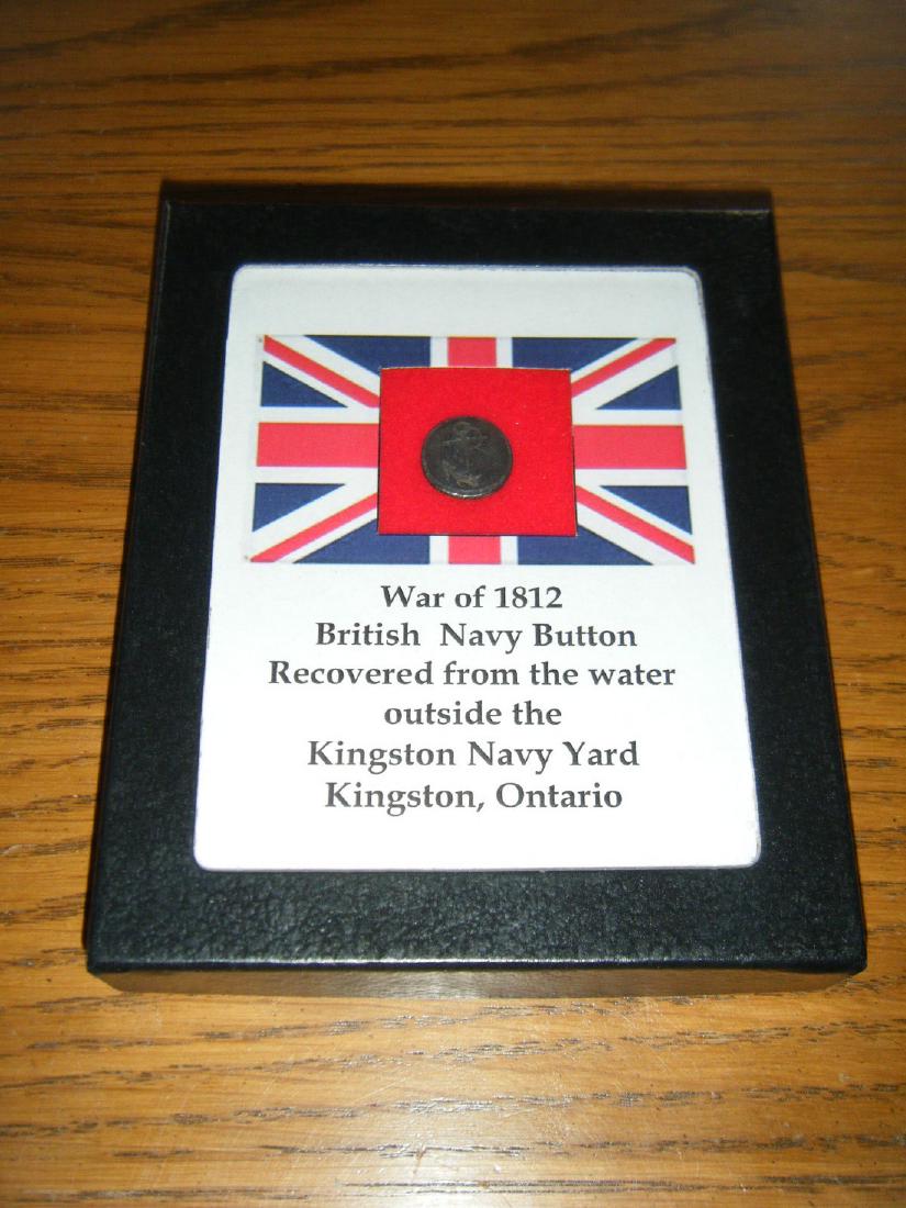 War of 1812 English Navy Button: Title: War of 1812 English Navy Button Dimension: The button measures 16 mm in diameter. Provenance:This button was recovered in the water outside the Kingston Navy Yard, Kingston, Ontario. The button