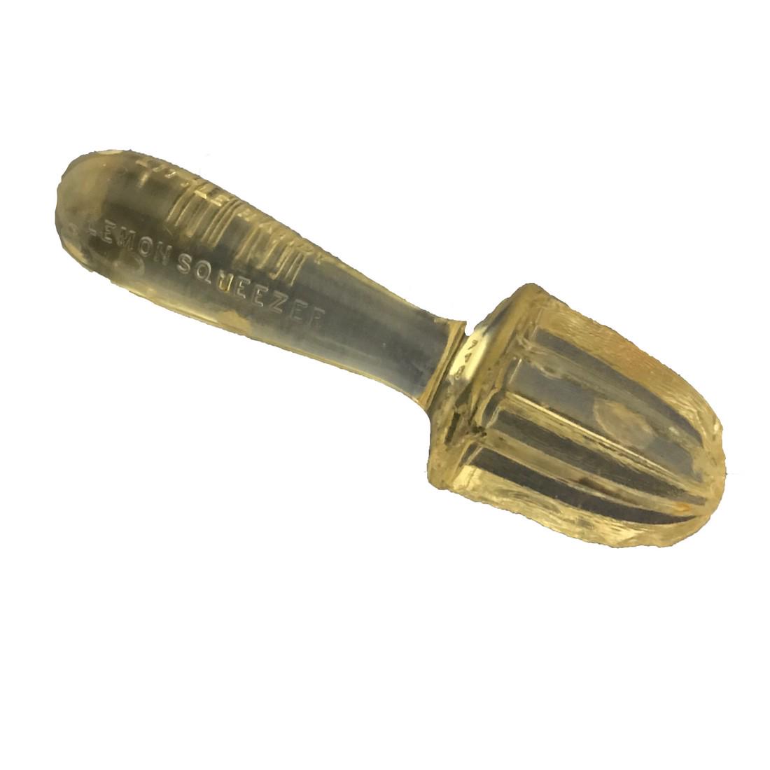 Lemon Reamer: Title: Lemon Reamer Dimension: 7” Provenance:A molded glass lemon reamer. Contains the wording LITTLE HANDY LEMON SQUEEZER. By Silver and Co. New York. Shipping: Domestic: Free shipping to anywhere