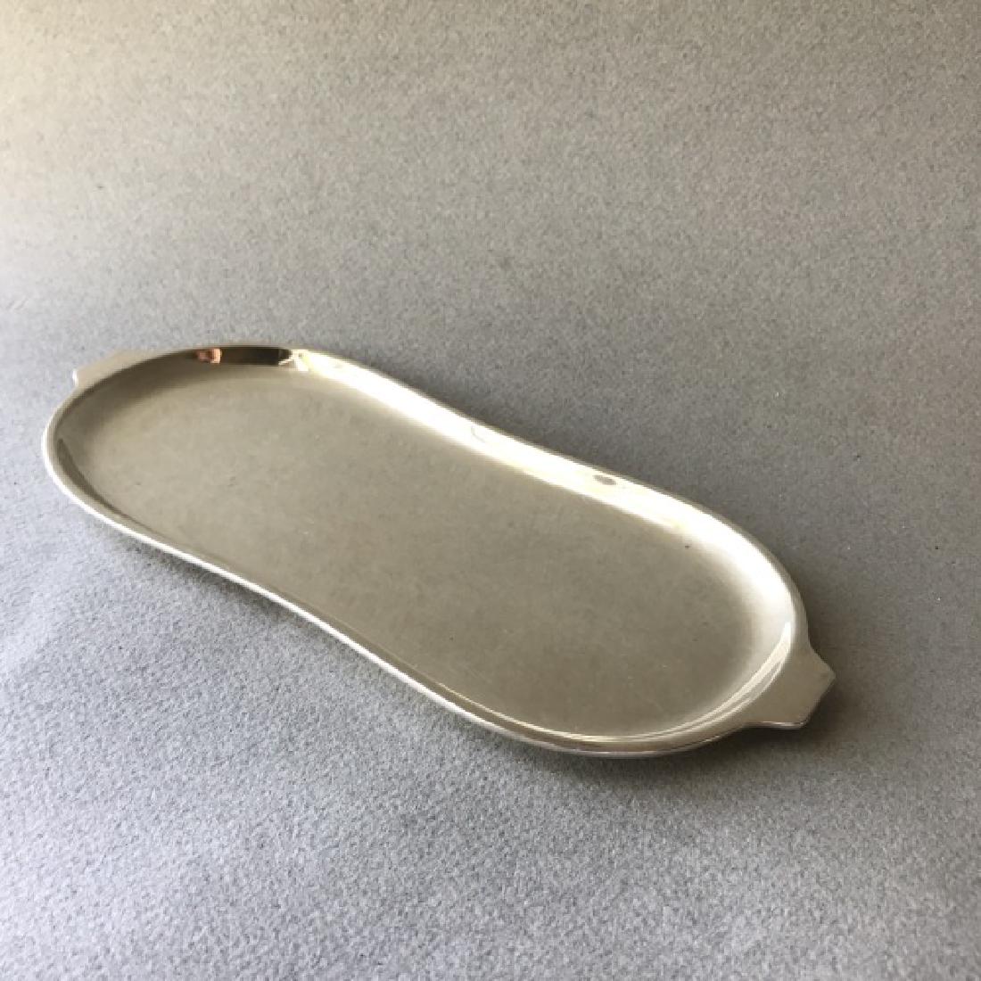 Georg Jensen Sterling Silver Tray No. 985: Georg Jensen Sterling Silver Tray No. 985 Sterling silver shaped tray designed by Magnus Stephensen for Georg Jensen. Interesting and uncommon piece made in the 1960's. Dated to the underside with a p