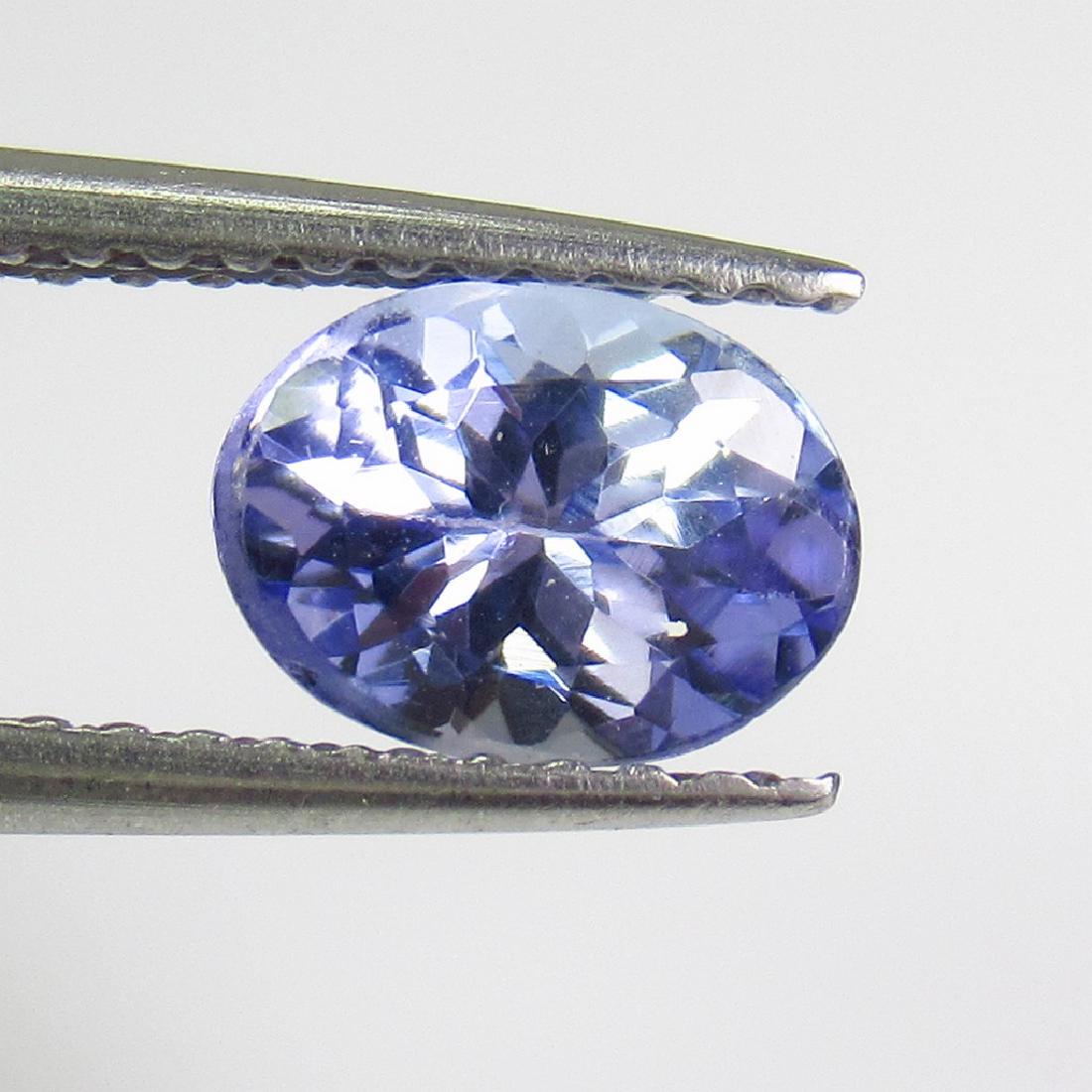 1.11 Ct Natural Bluish Violet Tanzanite 7X5 mm Oval Cut (1 of 2)
