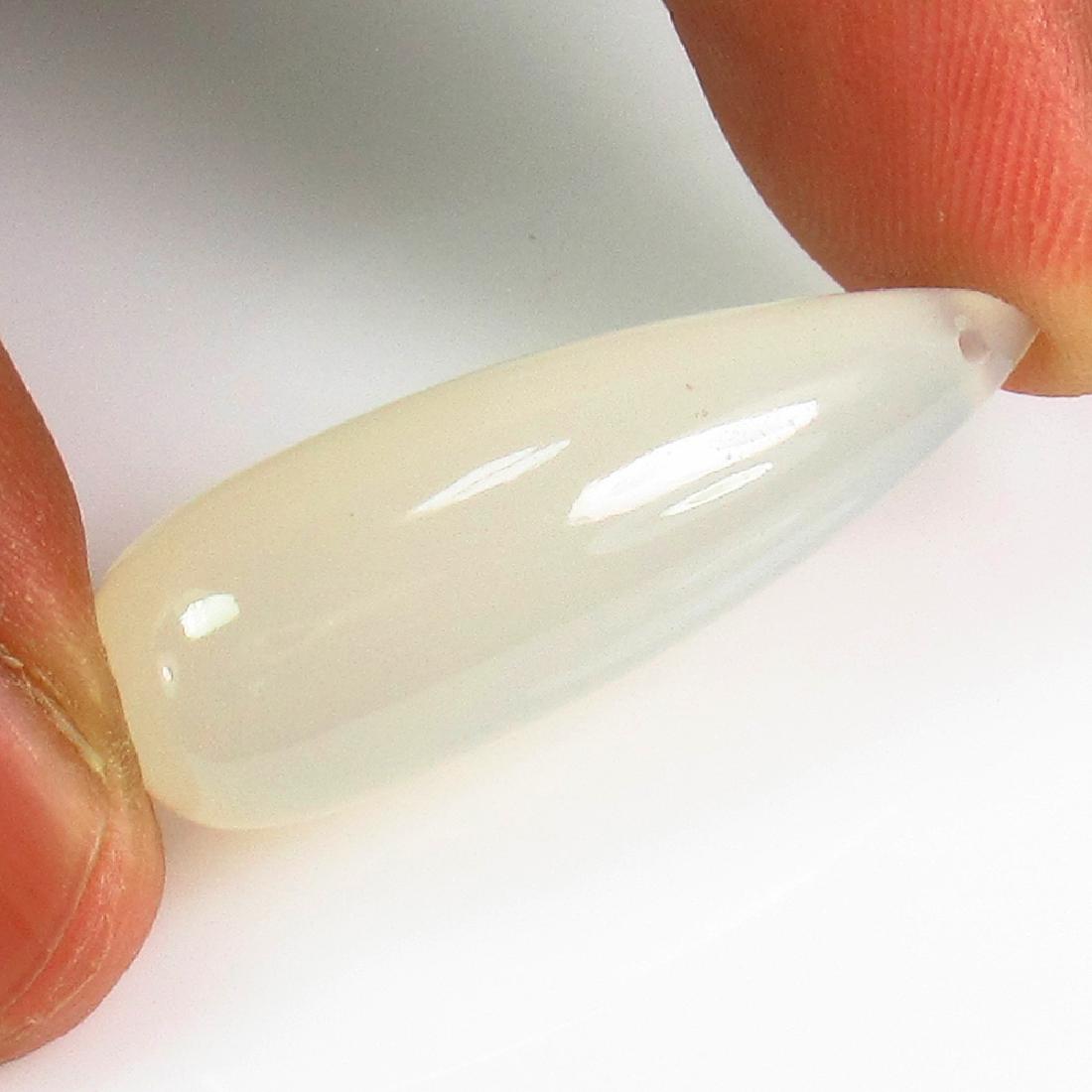 21.44 Ct Genuine White Chalcedony 30X10.5 mm Pear Drop: No Reserve! Title: 21.44 Ct Genuine White Chalcedony 30X10.5 mm Pear Drop Stone Clarity: Transparent Gemstones: Natural Chalcedony Carat Weights: 21.44 Size/Dimensions: 30.00 x 10.40 x 10.40 mm Additi