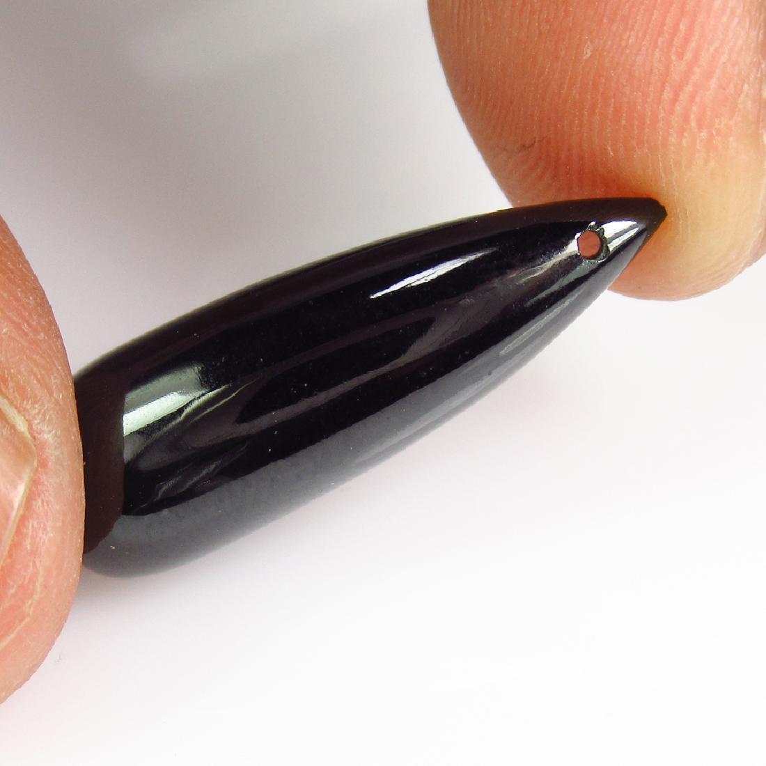 15.11 Ct Genuine Black Spinel 24X8 mm Drilled Pear Drop: No Reserve! Title: 15.11 Ct Genuine Black Spinel 24X8 mm Drilled Pear Drop Stone Clarity: Opaque Gemstones: Natural Spinel Carat Weights: 15.11 Size/Dimensions: 24.00 x 24.00 x 8.10 mm Additional Info
