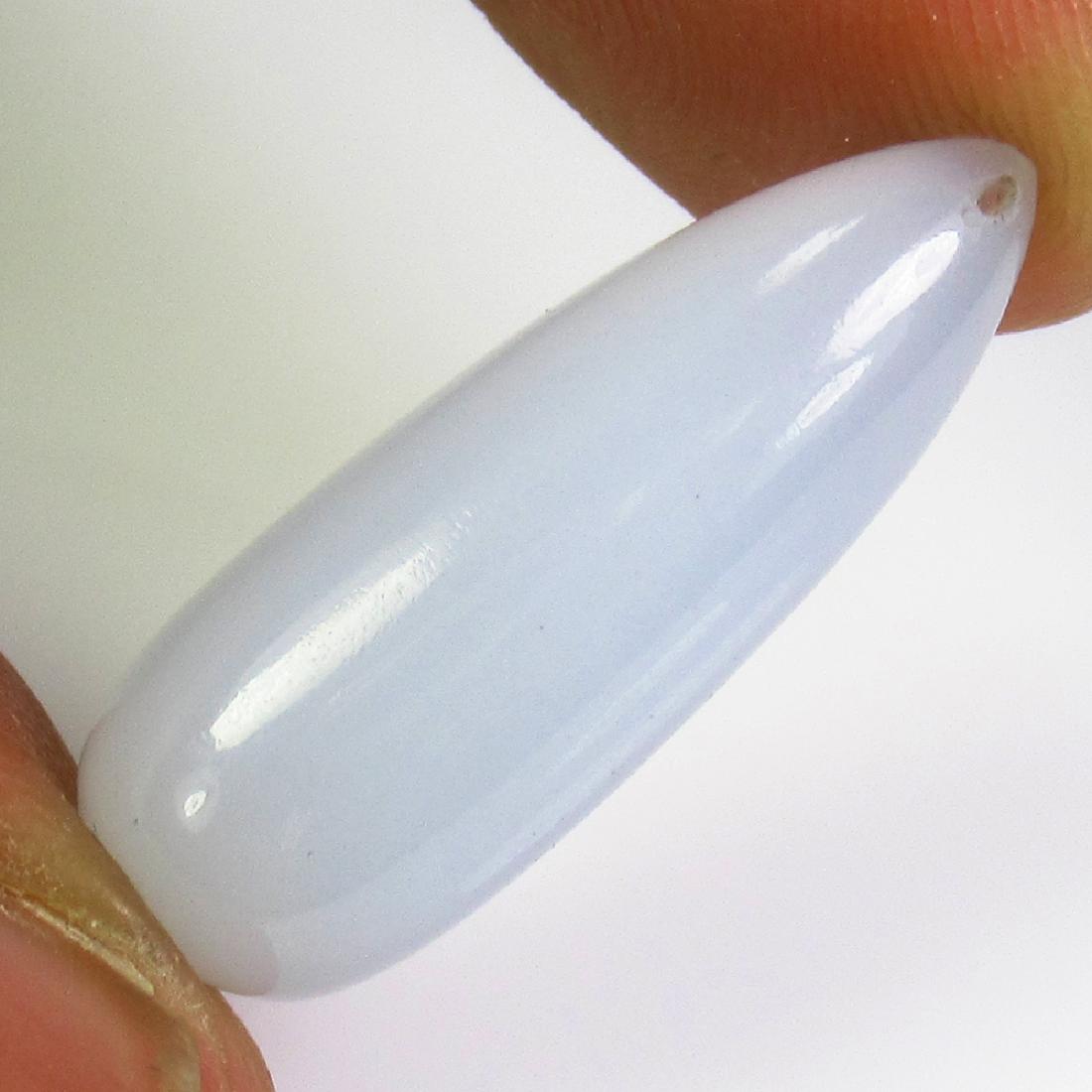 15.27 Ct Genuine White Chalcedony 23X9.2 mm Pear Drop: No Reserve! Title: 15.27 Ct Genuine White Chalcedony 23X9.2 mm Pear Drop Stone Clarity: Transparent Gemstones: Natural Chalcedony Carat Weights: 15.27 Size/Dimensions: 23.00 x 9.20 x 9.20 mm Additiona