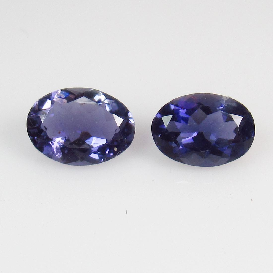 1.57 Ct Genuine Iolite 7.8X5.7 mm Oval Pair: No Reserve! Title: 1.57 Ct Genuine Iolite 7.8X5.7 mm Oval Pair Stone Clarity: VVS Gemstones: Natural Iolite Carat Weights: 1.57 Size/Dimensions: 7.80 x 5.70 x 3.30 mm Additional Information: Very Good