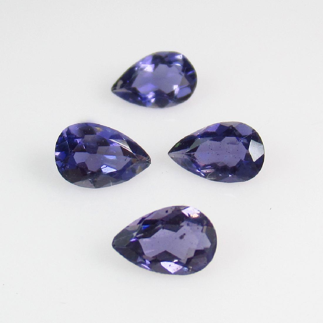 1.32 Ctw Natural 4 Iolite Pear Set: No Reserve! Title: 1.32 Ctw Natural 4 Iolite Pear Set Stone Clarity: VVS Gemstones: Iolite Carat Weights: 1.32 Size/Dimensions: 6.20 x 3.90 x 2.60 mm Additional Information: Very Good Luster / Excelle