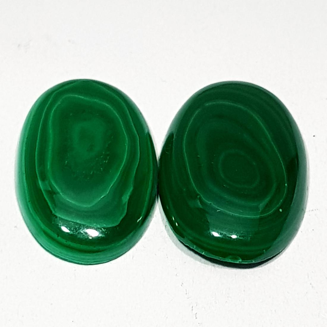 23.07 ct Pair of Natural Malachite: No Reserve! Title: 23.07 ct Pair of Natural Malachite Color/Clarity: Opaque Loosegemstone Carat Weights: 23.07 Size/Dimensions: 20.22 x 13.05 x 4.14 Oval - Africa Shipping: Worldwide: Flat-rate of $10