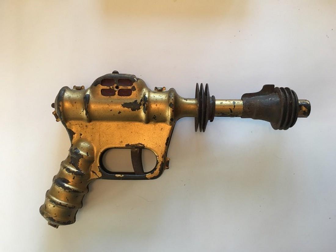 Buck Rogers Atomic Space Pistol: Title: Buck Rogers Atomic Space Pistol Date: 1930 Dimensions: 10 by 6 Shipping: Domestic: Flat-rate of $15.00 to anywhere within the contiguous U.S. International: Foreign shipping rates are determine
