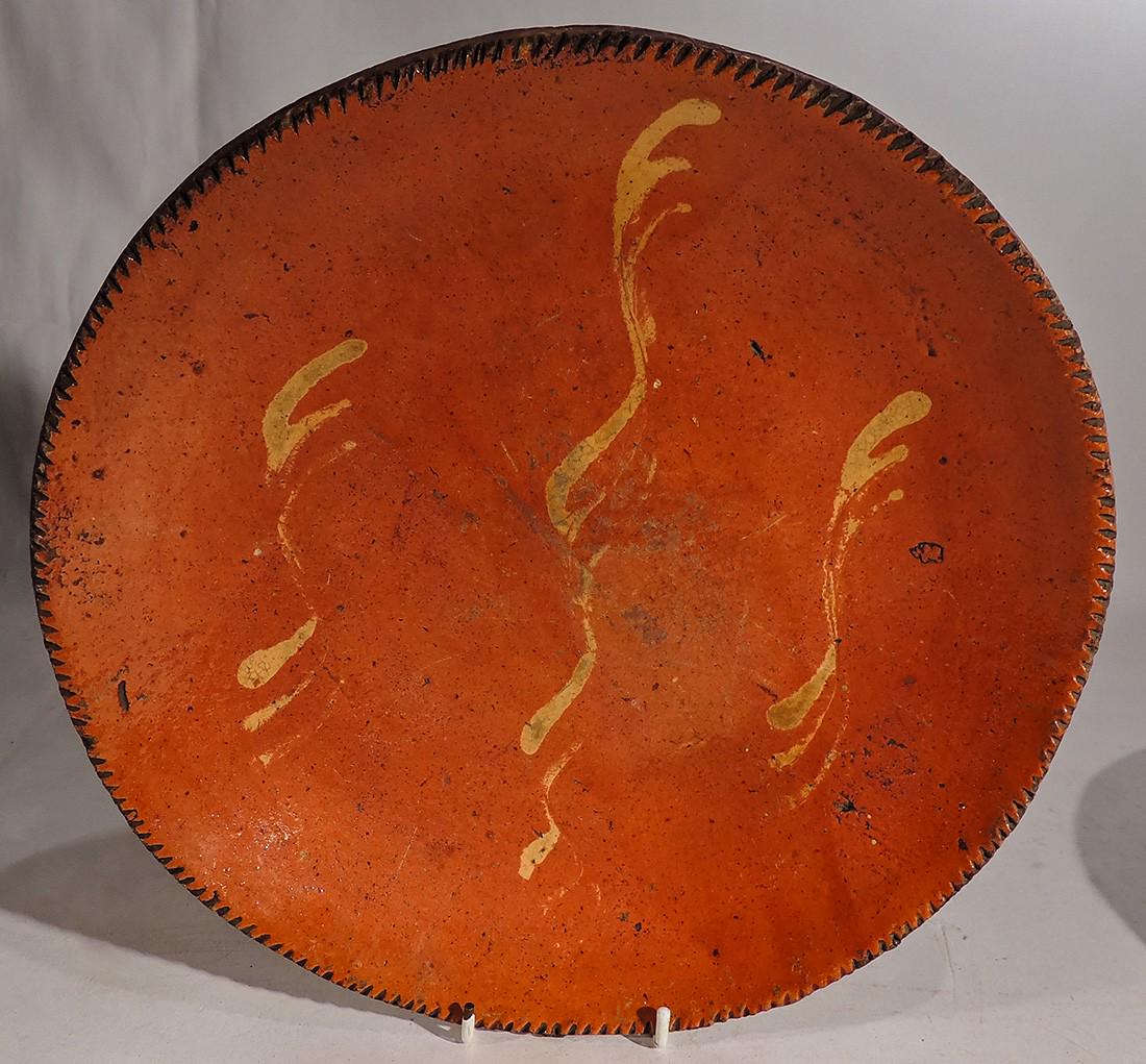 Slip Decorated Redware Charge: Title: Slip Decorated Redware Charge Date/Period: Early 1790 Origin: American Dimension: 11 1/4" D Provenance:Slip Decorated Redware Charge Shipping: Domestic: Flat-rate of $40.00 to anywhere within t