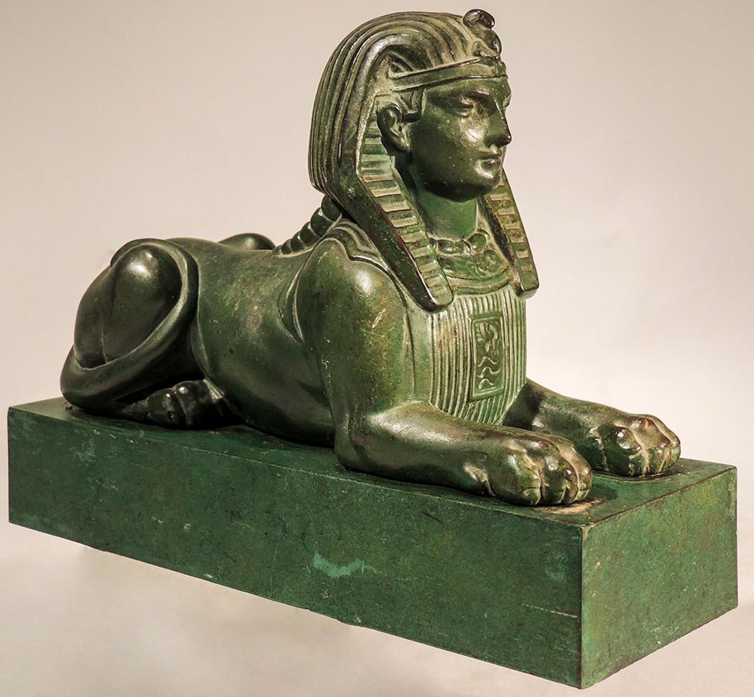 Exquisite Sphinx Doorstop: Title: Exquisite Sphinx Doorstop Date/Period: 1900 Origin: French Dimension: 6" H x 2 1/2" D x 7 1/2" L Provenance:Exquisite cast cast iron Sphinx doorstop in green paint Shipping: Domestic: Flat-rate