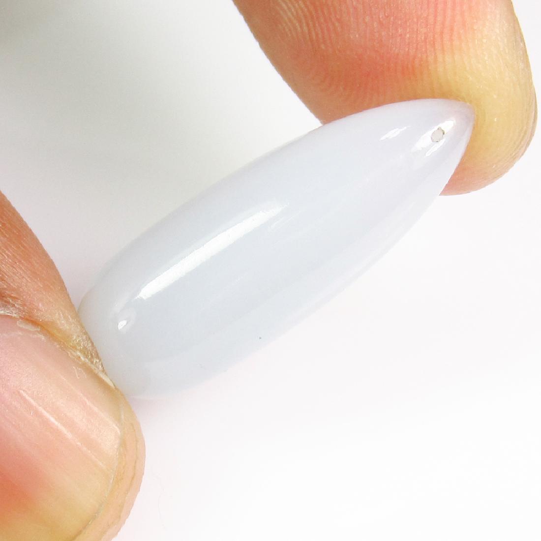 15.35 Ctw Natural White Chalcedony 24X9 mm Pear Drop: No Reserve! Title: 15.35 Ctw Natural White Chalcedony 24X9 mm Pear Drop Stone Clarity: Transparent Gemstones: Chalcedony Carat Weights: 15.35 Size/Dimensions: 24.00 x 9.10 x 9.10 mm Additional Informa