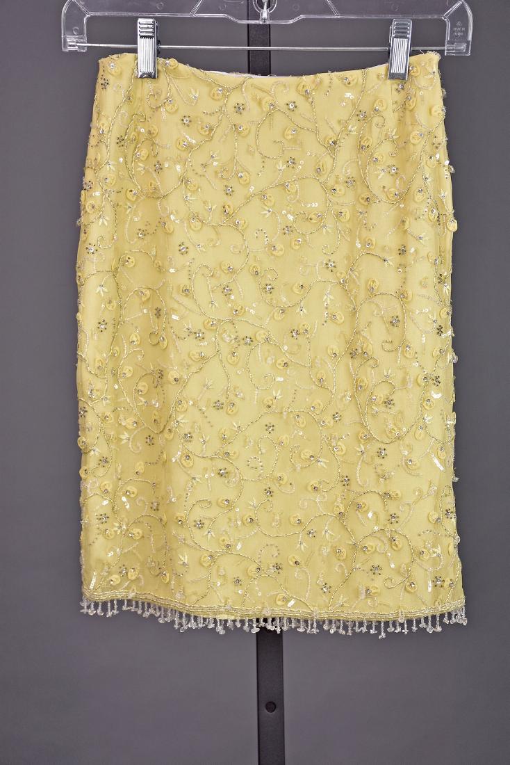 ESCADA Yellow Silk Beaded Skirt : This skirt was previously owned by Susan Lucci of All My Children fame, sold to raise money for charity. The fabric is 100% silk in a lovely shade of yellow covered in a beaded foliate pattern highlig
