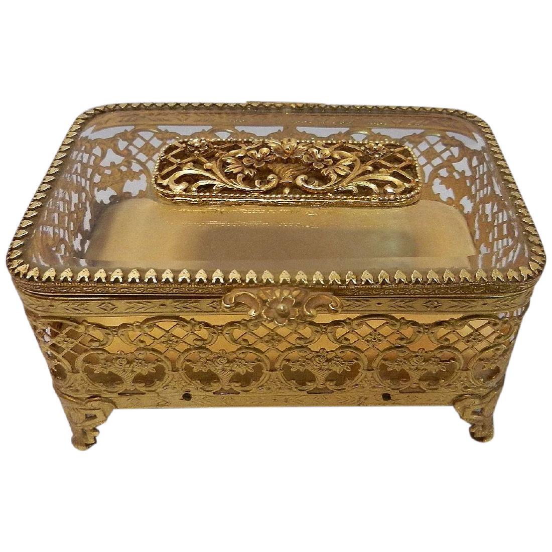 Vintage Mid Century Matson 24 KT. Gold Plated Floral: This Vintage Matson 24 KT. Gold Plated Floral Filigree Jewelry Casket with Beveled Glass is one of the most beautiful and delicate decorated caskets I have sold. It is in excellent condition. The box 