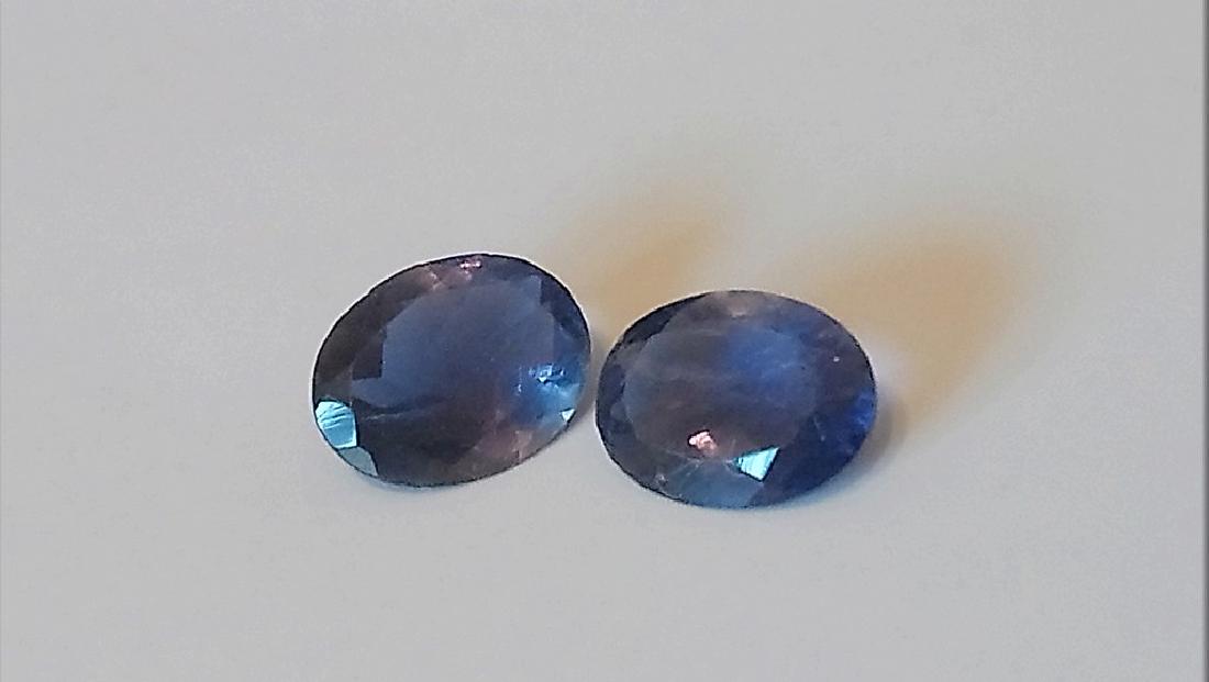 1.80 ct iolite oval pair: Title: 1.80 ct iolite oval pair Color/Clarity: blue/VS Gemstone Type: untreated Carat Weights: 1.8 Size/Dimensions: 8.10x6.13x3.09 mm Reserve: $10.00 Shipping: Domestic: Flat-rate of $7.00 to anywher