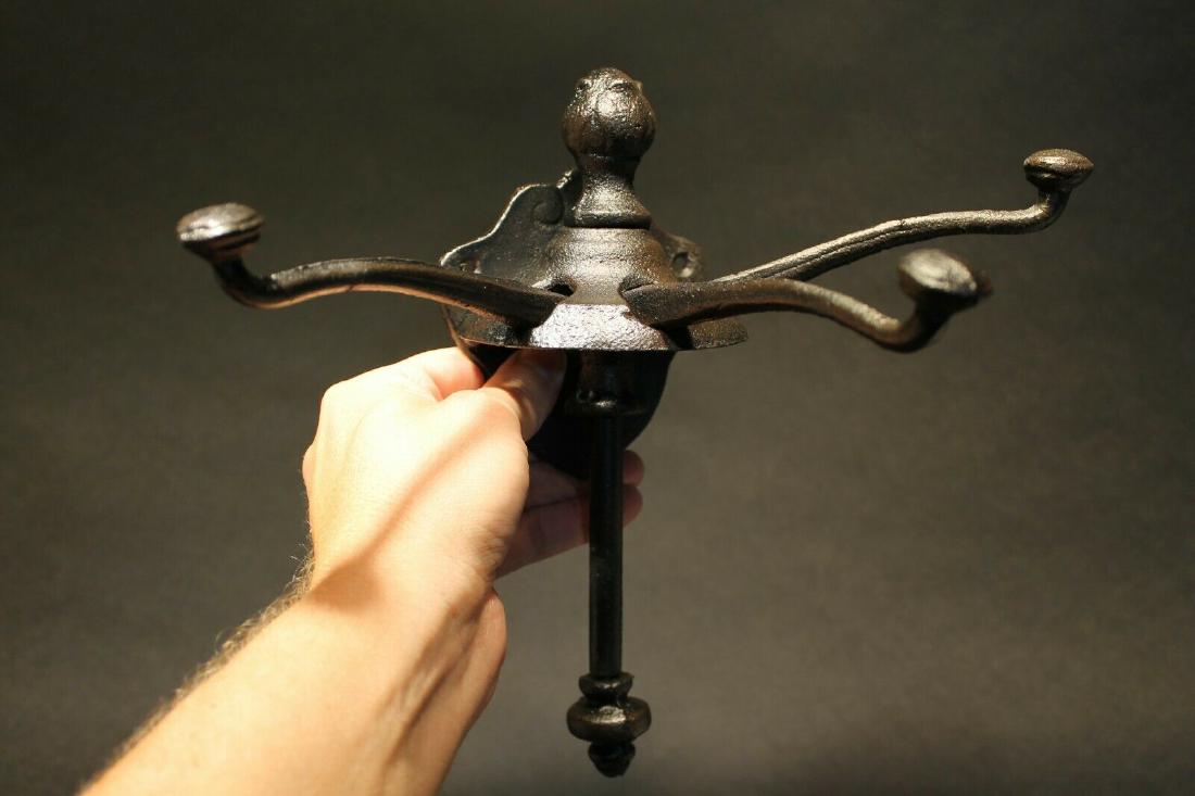 Black Cast Iron Hook Sliding Coat Clothing Hanger: (1) Hook 9 1/2" Tall.. 4 1/8" Wide 7" Extension 1 Charming and functional reproduction sturdy iron wall hook cast from an antique. As you can see this unique and genius design has a slide that allows