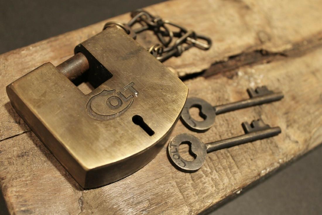 Brass Colt Firearms Ammo Box Padlock Lock & key: 2 3/8" wide x 2 1/2" tall x 7/8" Wide Nice reproduction brass Colt padlock! This lock is fully functional! Hard to tell its age. Heavy solid brass and iron. Great aged patina throughout. Reserve: $40.