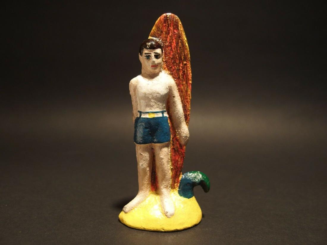 Cast Iron Male Surfer Beach Beer Bottle Opener: 4 1/2" Tall Well made reproduction antique cast iron male surfer bottle opener. Nice detailed casting.. good heavy solid piece.. Reserve: $12.00 Shipping: Domestic: Flat-rate of $6.00 to anywhere with