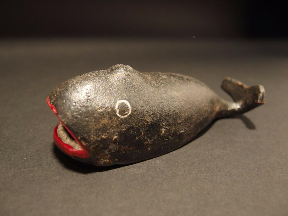 Cast Iron Whale Beer Soda Bottle Cap Opener: 5" Long x 1 3/4" Wide Great folk art cast iron bottle opener. This piece was hand painted and aged to look like an antique. Reserve: $10.00 Shipping: Domestic: Flat-rate of $10.00 to anywhere within t
