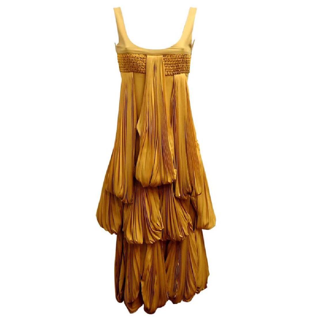 Byblos; Long origami dress: 2008 Origami collection Silk plissé Fantastic work of folds and embroidery Yellow ochre color Total lenght (shoulder/hem) cm 132 (51.9 inches) Perfect for gala event or ceremony Reserve: $1,000.00 Sh