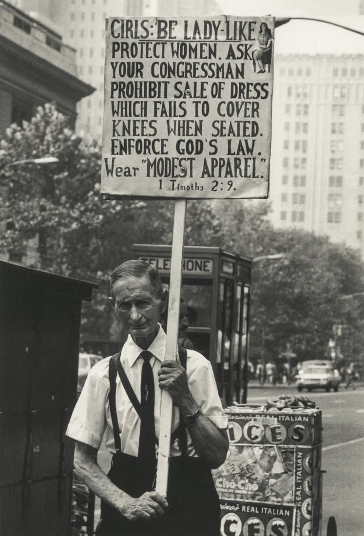 STEVE SCHAPIRO - Man With Sign, New York, 1962: Artist: Steve Schapiro Title: Man With Sign, New York, 1962Medium: Photo Litho, 2000, Italy Dimensions: 6.25x9.2" Heat Wax Mounted on 11x14" Conservation Board Steve Schapiro (1934) is an American pho