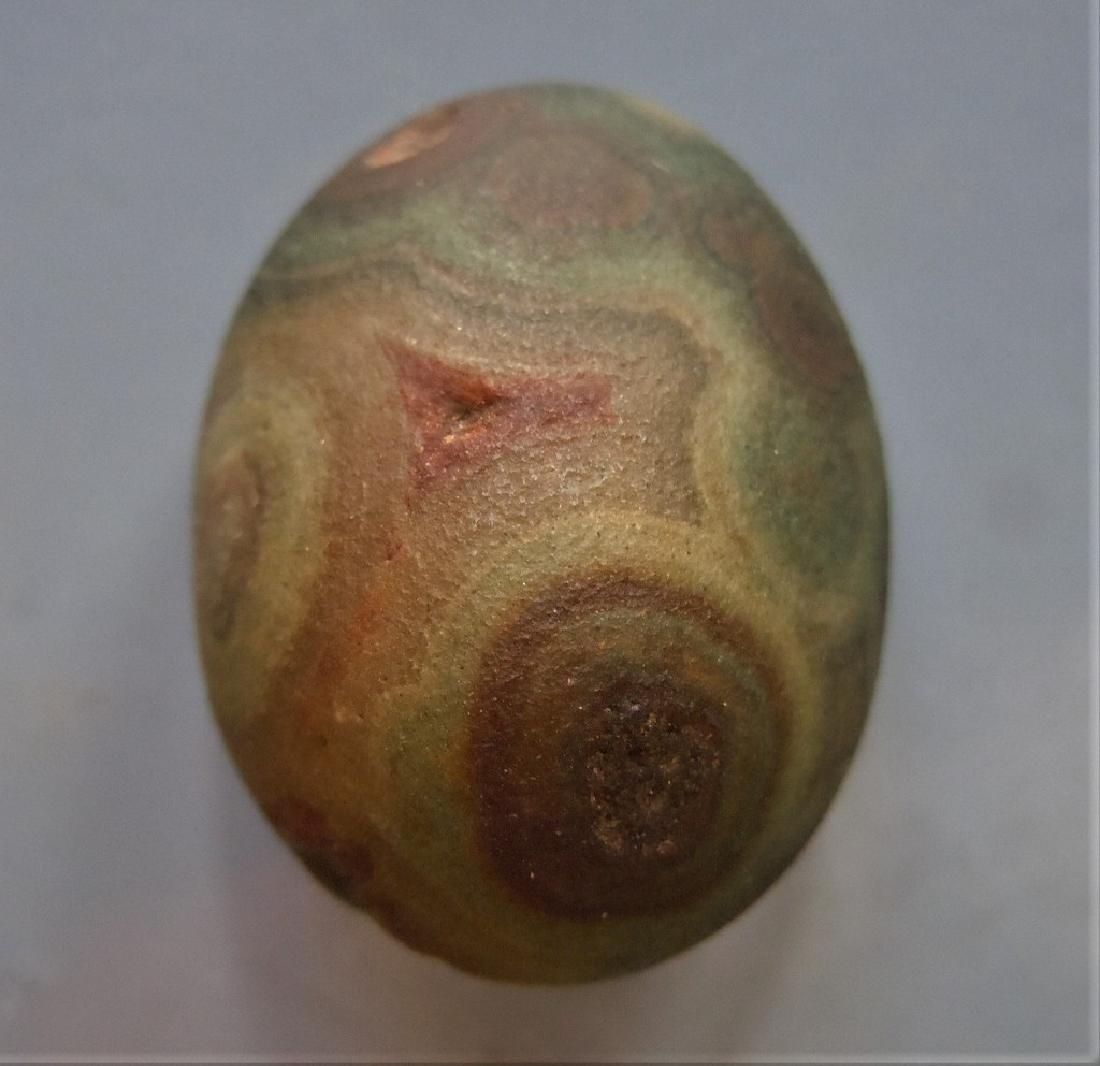 GORGEOUS EYE AGATE - 100% NATURAL: Title: GORGEOUS EYE AGATE - 100% NATURAL Origin: Alashan Area, Gobi Desert, Inner Mongolia, China Size: 2.1x1.6x1.4 cm / 7 gram Description:gorgeous egg shaped, dark green eye agate with silky-smooth 