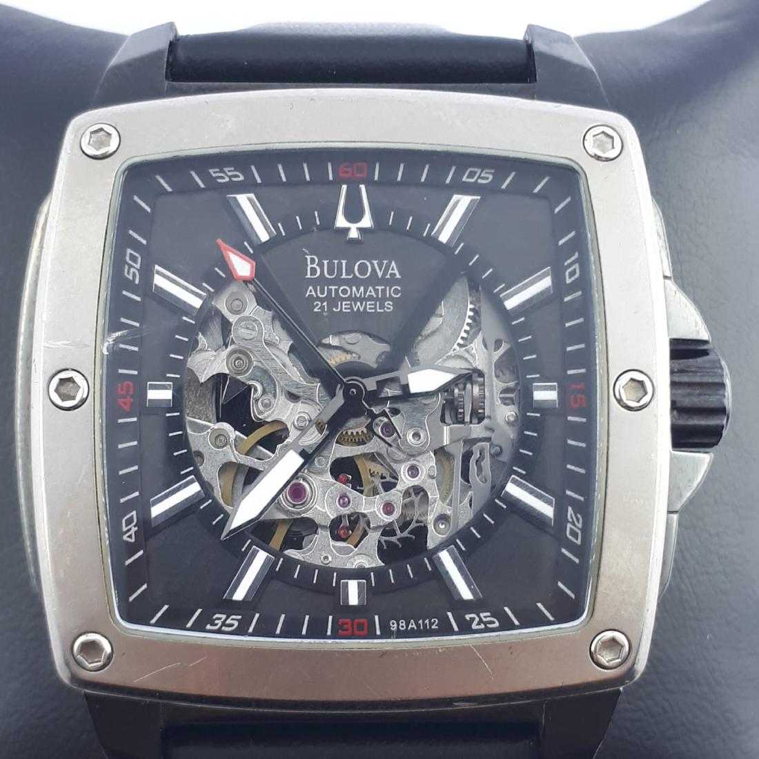 Bulova - Open Heart Square Automatic - Men - 2000-2010: Brand : Bulova Model : Open Heart Square Automatic Gender : Men Period : 2000-2010 Movement : Automatic Case material : Steel Extras : Universal Watch Box Type : Analogue wristwatch Case Size : 1,57 x