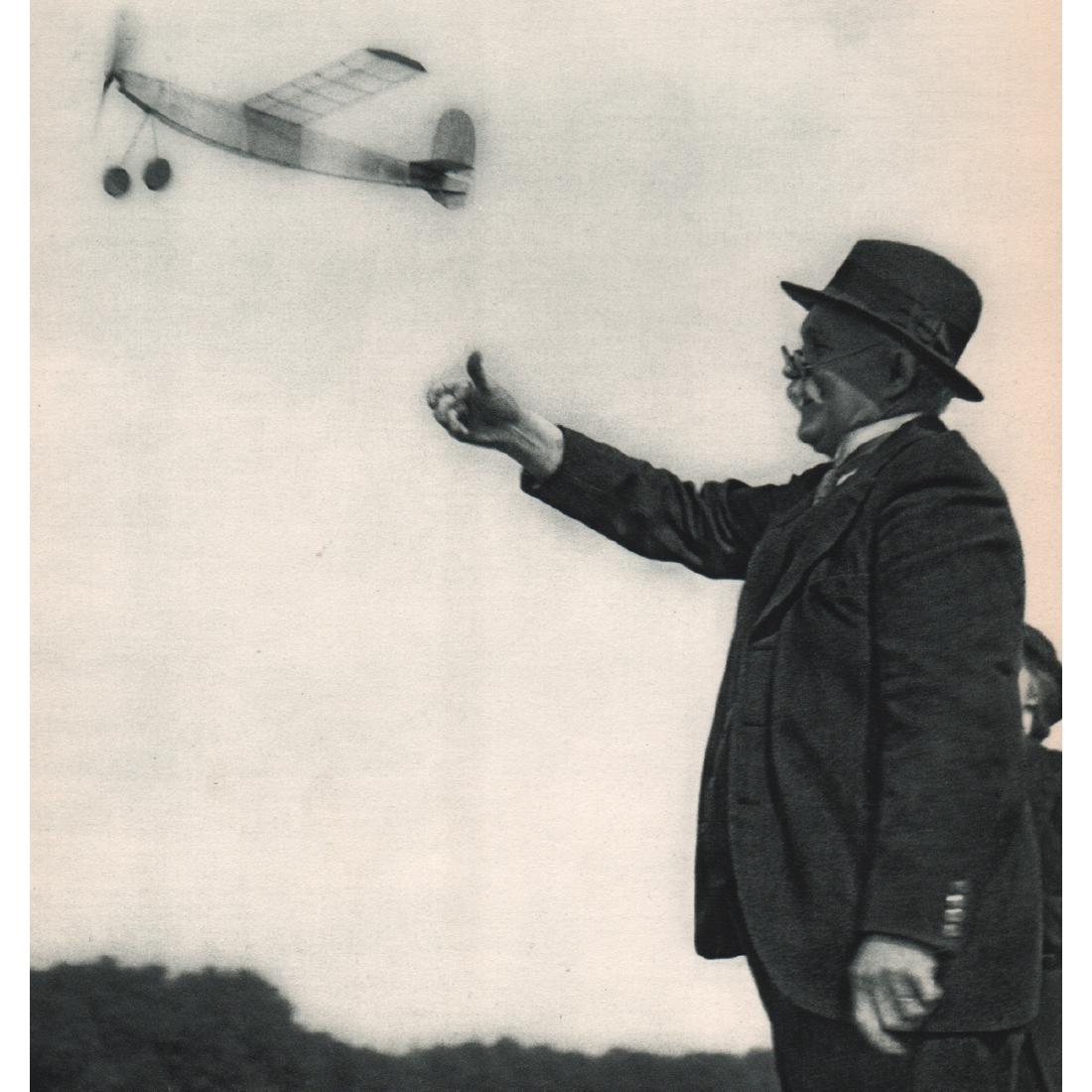 ROBERT DOISNEAU - Mechanical Dragonfly launched at The: Artist: ROBERT DOISNEAU Print Title: Mechanical Dragonfly launched at The Vincennes Polygone, Paris Medium: Sheet-fed Gravure Printing Date: 1950's Printed in France Image Size approx: 7.5 x 8 inches