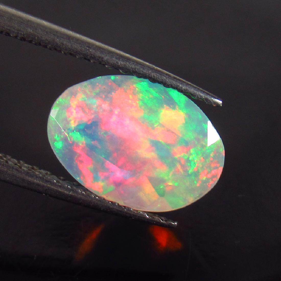 1.38 Ctw Natural Faceted Opal 10.4X7.5 mm Oval  Cut (1 of 2)