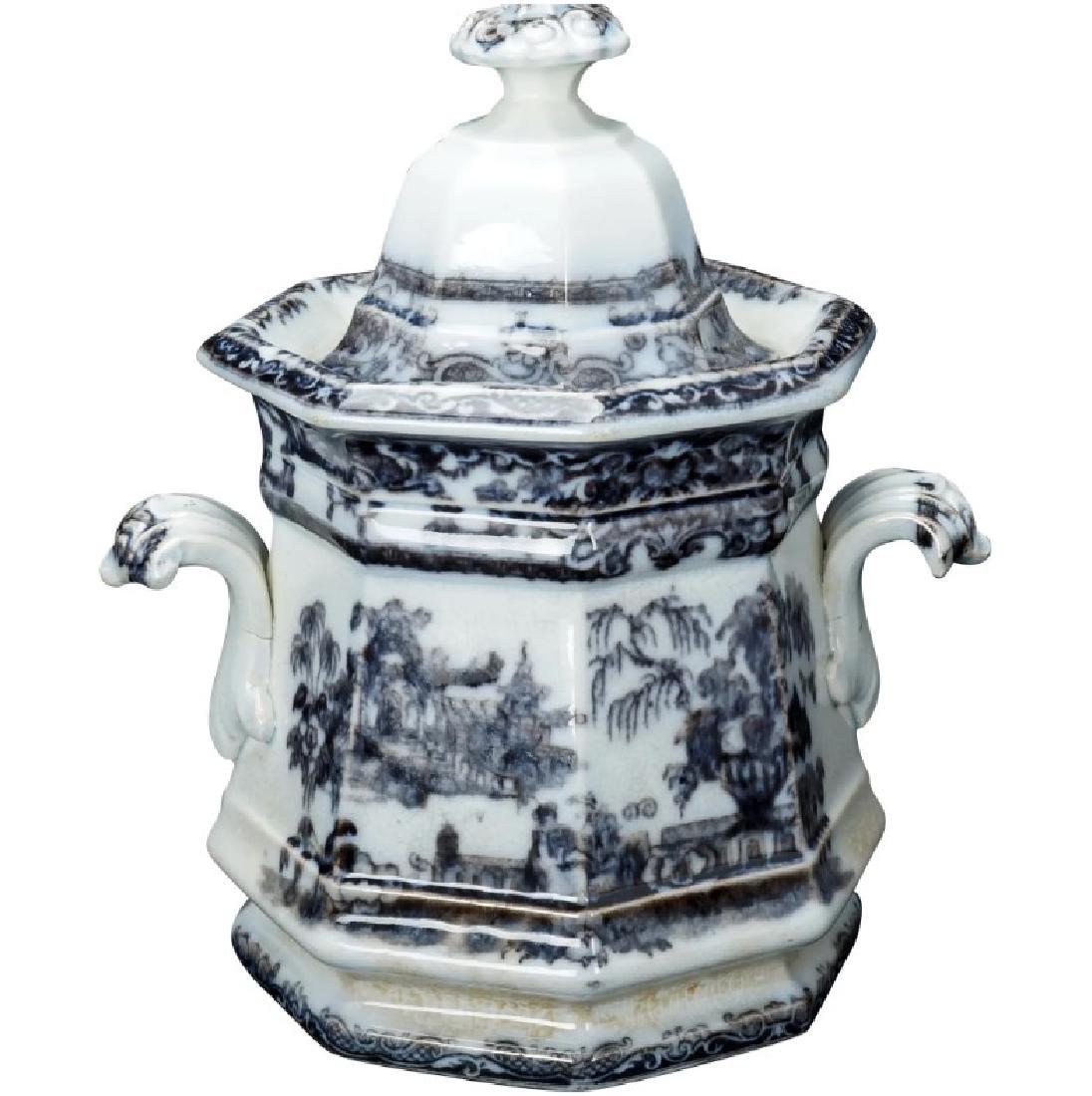 English Victorian Staffordshire Transferware Sugar Mid: An octagonal sugar bowl with matching lid that has a dreamy mulberry transfer design of an exotic temple or palace set in a lush garden. The heavy low fired ceramic sugar bowl with lid has been coated