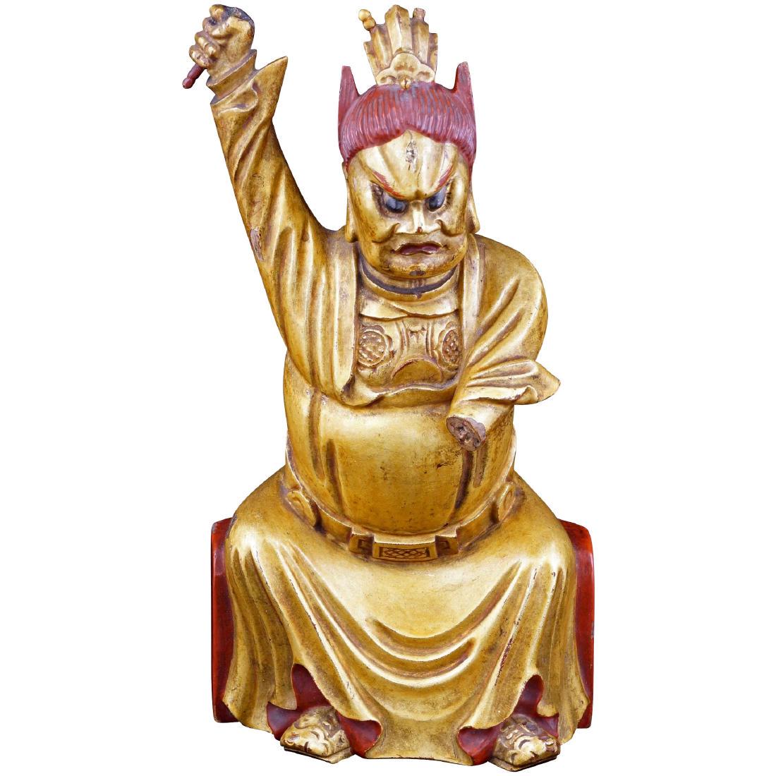 Gilded Wood Chinese temple guardian late 19th century: Ferocious well carved gold and red Chinese temple guardian to protect you from demon spirits. Wooden carved figure with red and gold lacquer. The wood is fine grained and heavy, and the carving has go