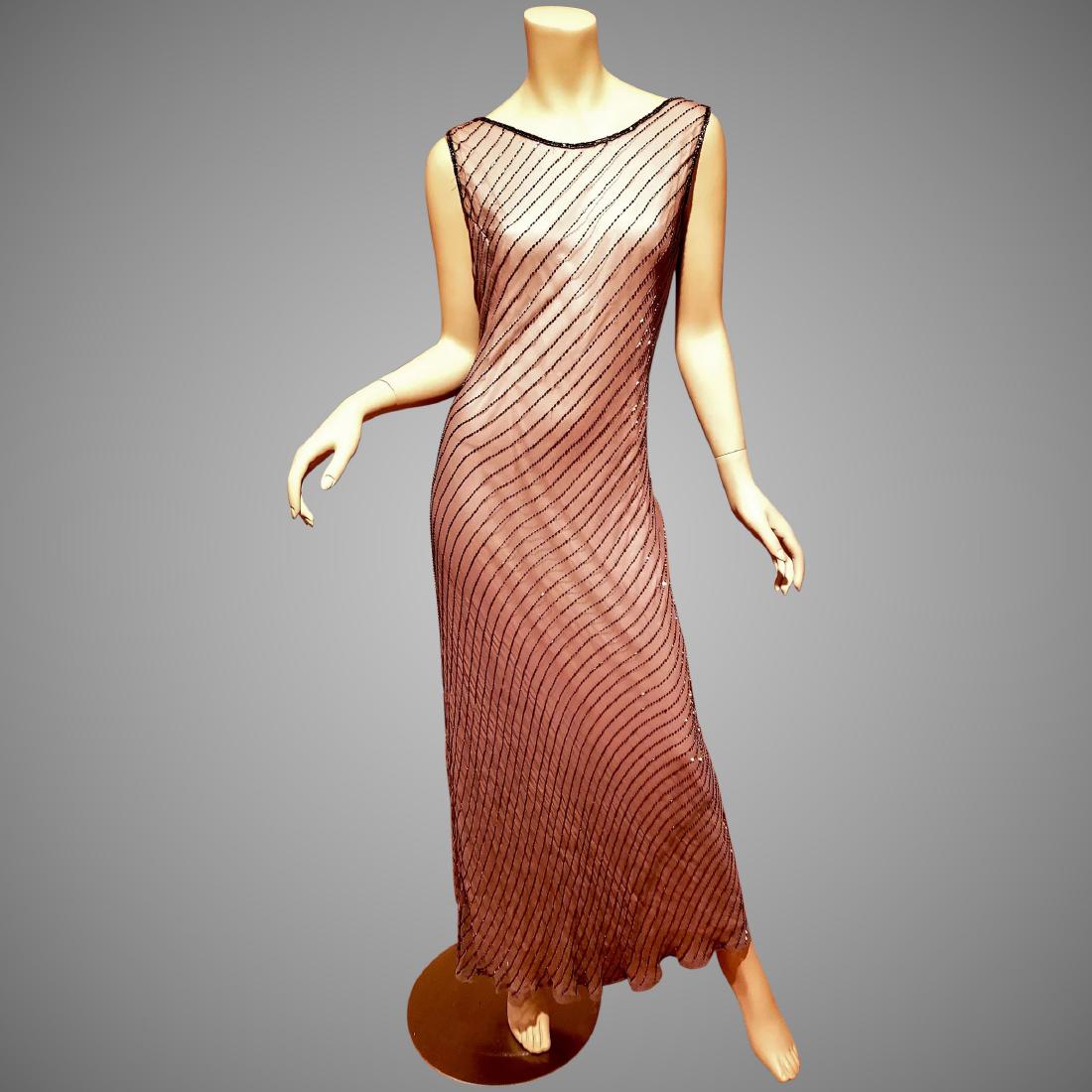 Vtg silk beaded bias cut maxi layering dress/gown: Very beautiful beaded bias cut maxi dress. In a gun Metal/Bronze coloration. In very good vintage condition. One line of beads is missing at back but it looks like a design. A vintage size 14 will fit