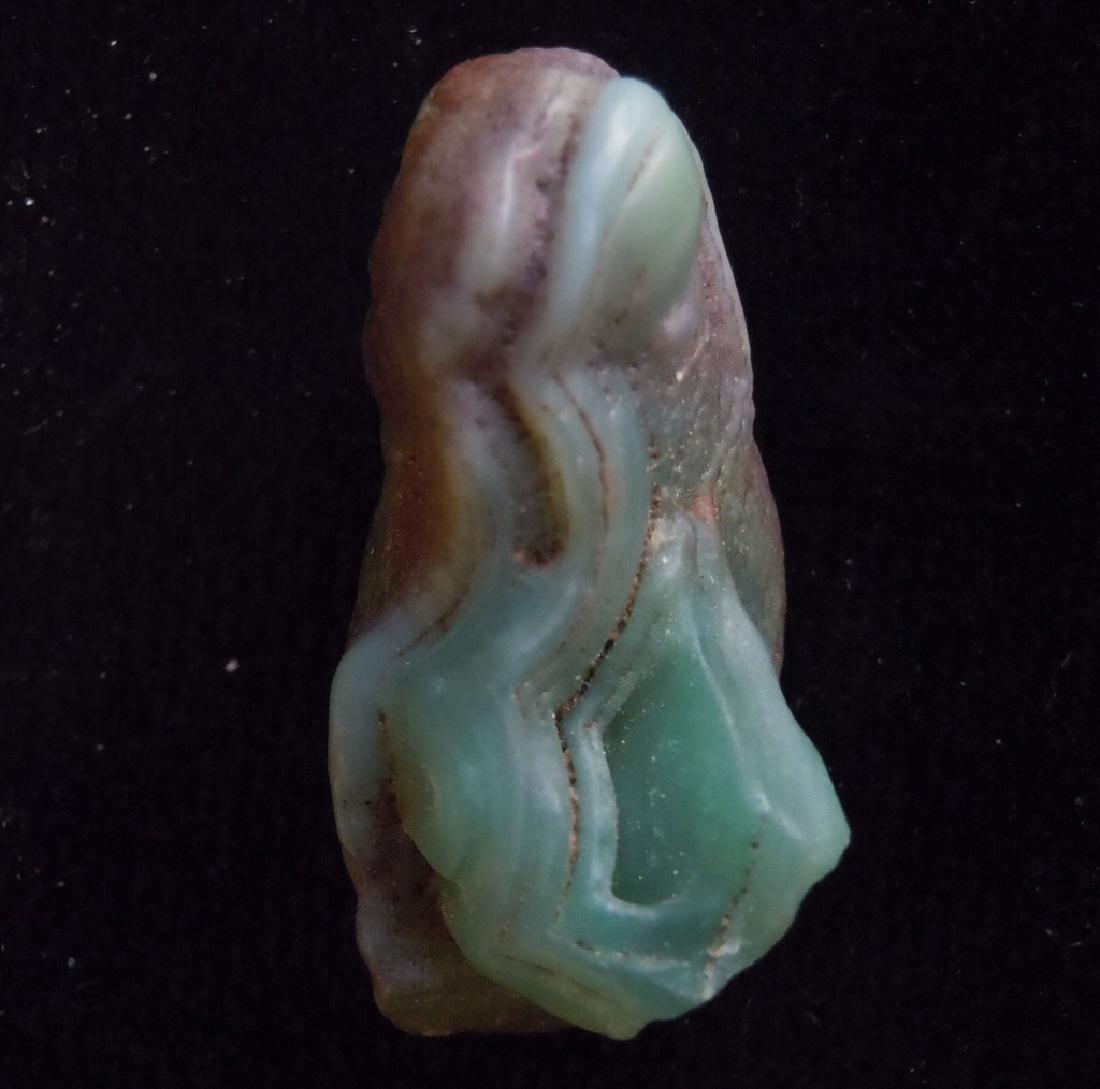 STUNNING EYE AGATE - 100 % NATURAL: Title: STUNNING EYE AGATE - 100 % NATURAL Origin: Alashan Area, Gobi Desert, Inner Mongolia, China Size: 3.4x1.9x1.8 cm / 12 gram Additional Information: stunning green eye agate Reserve: $10.00 Shipp