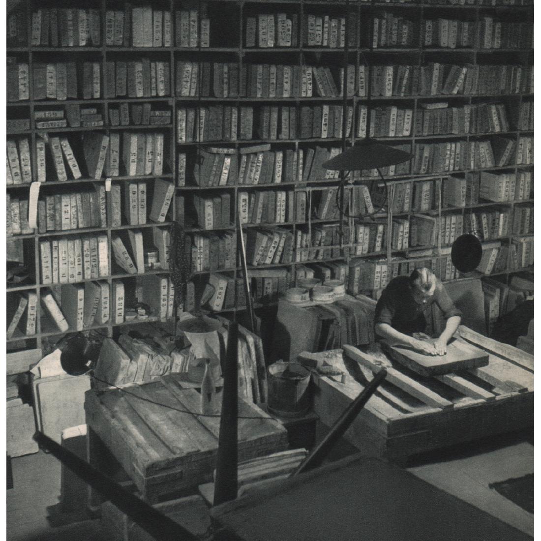 ROBERT DOISNEAU - Polishing a Lithograph: Artist: ROBERT DOISNEAU Print Title: Polishing a Lithograph Medium: Sheet-fed Gravure Printing Date: 1950's Printed in France Image Size approx: 7.25 x 7.25 inches Robert Doisneau (1912-1994) was a Fr