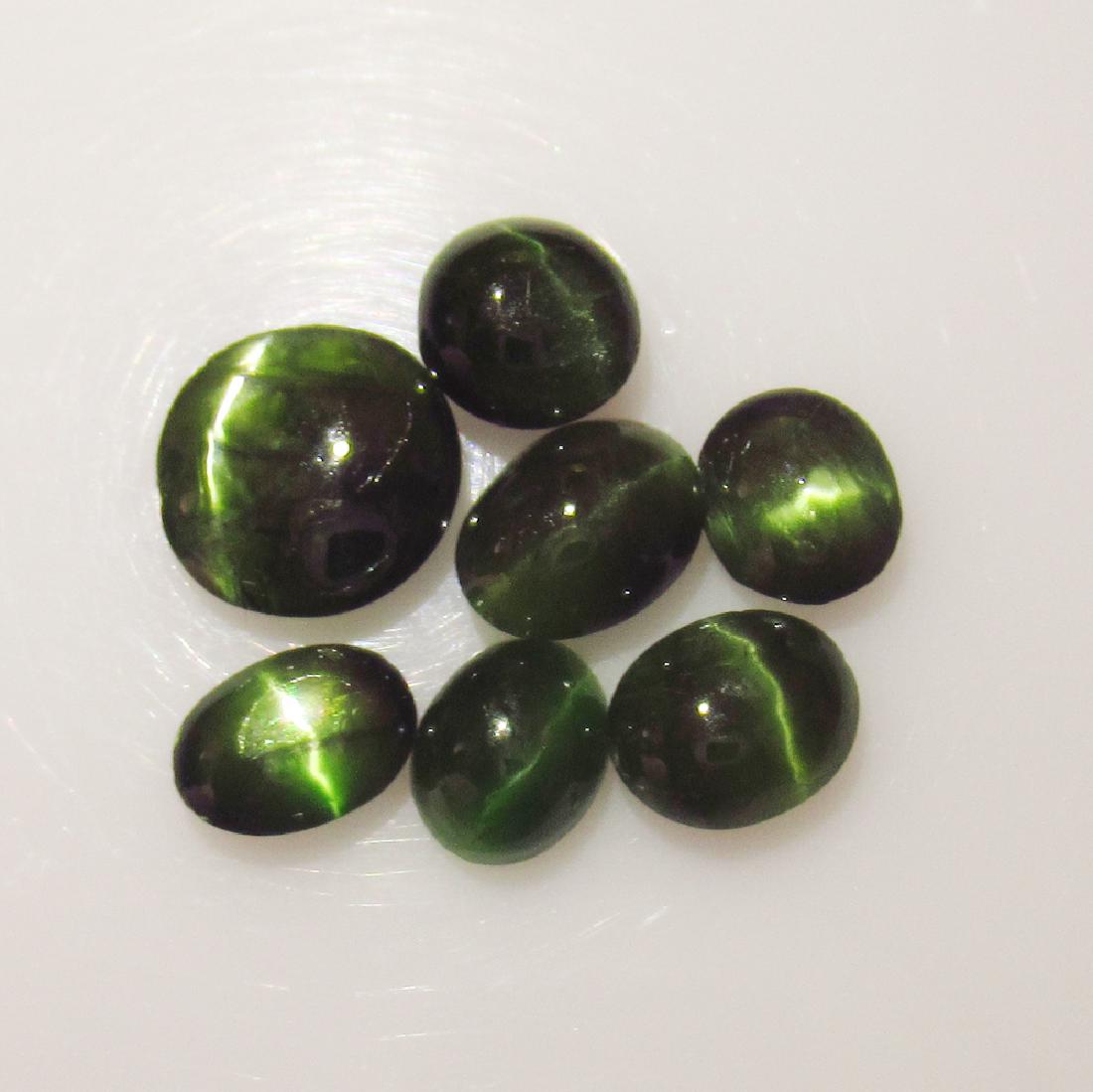 7.89 Ct Genuine Six Line 7 Black Star Sapphire Oval Cab: No Reserve! Title: 7.89 Ct Genuine Six Line 7 Black Star Sapphire Oval Cab Stone Clarity: Opaque Gemstones: Natural Black Star Sapphire Carat Weights: 7.89 Size/Dimensions: 6.60 x 5.20 to 8.70 x 8.50