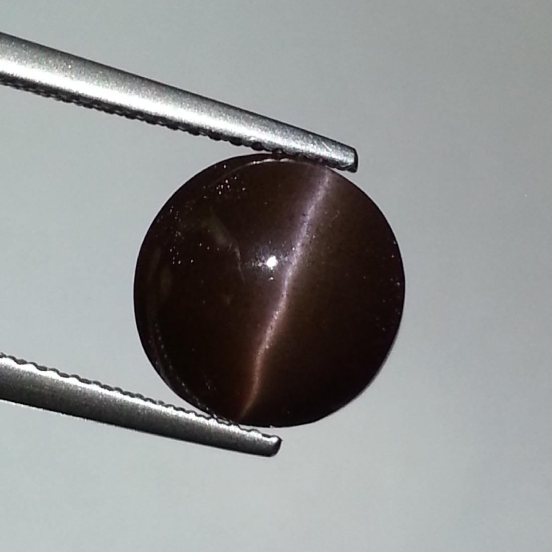 Natural Scapolite Cat's Eye 6.50 ct: No Reserve! Title: Natural Scapolite Cat's Eye 6.50 ct Color/Clarity: Opaque Gemstones: Loosegemstone Carat Weights: 6.5 Size/Dimensions: 10.70 x 10.70 x 7.20 Additional Information: Round - Africa Sh