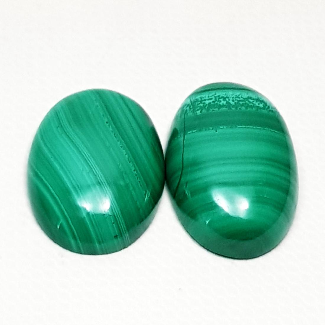 24.70 ct Pair of Natural Malachite: No Reserve! Title: 24.70 ct Pair of Natural Malachite Color/Clarity: Opaque Gemstones: Loosegemstone Carat Weights: $25 Size/Dimensions: 18.80 x 11.85 x 5.30/17.90 x 12.20 x 4.60 Additional Informatio