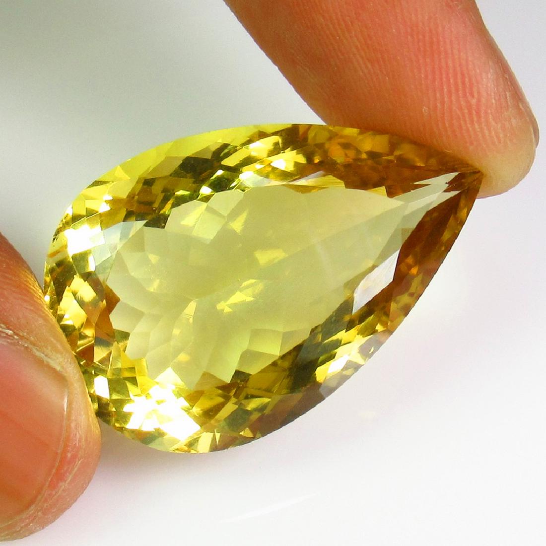 37.34 Ct Genuine Lemon Quartz 30X20 mm Pear Cut BigSize: Title: 37.34 Ct Genuine Lemon Quartz 30X20 mm Pear Cut BigSize Stone Clarity: VVS Gemstones: Natural Lemon Quartz Carat Weights: 37.34 Size/Dimensions: 30.00 x 20.00 x 12.40 mm Additional Information:
