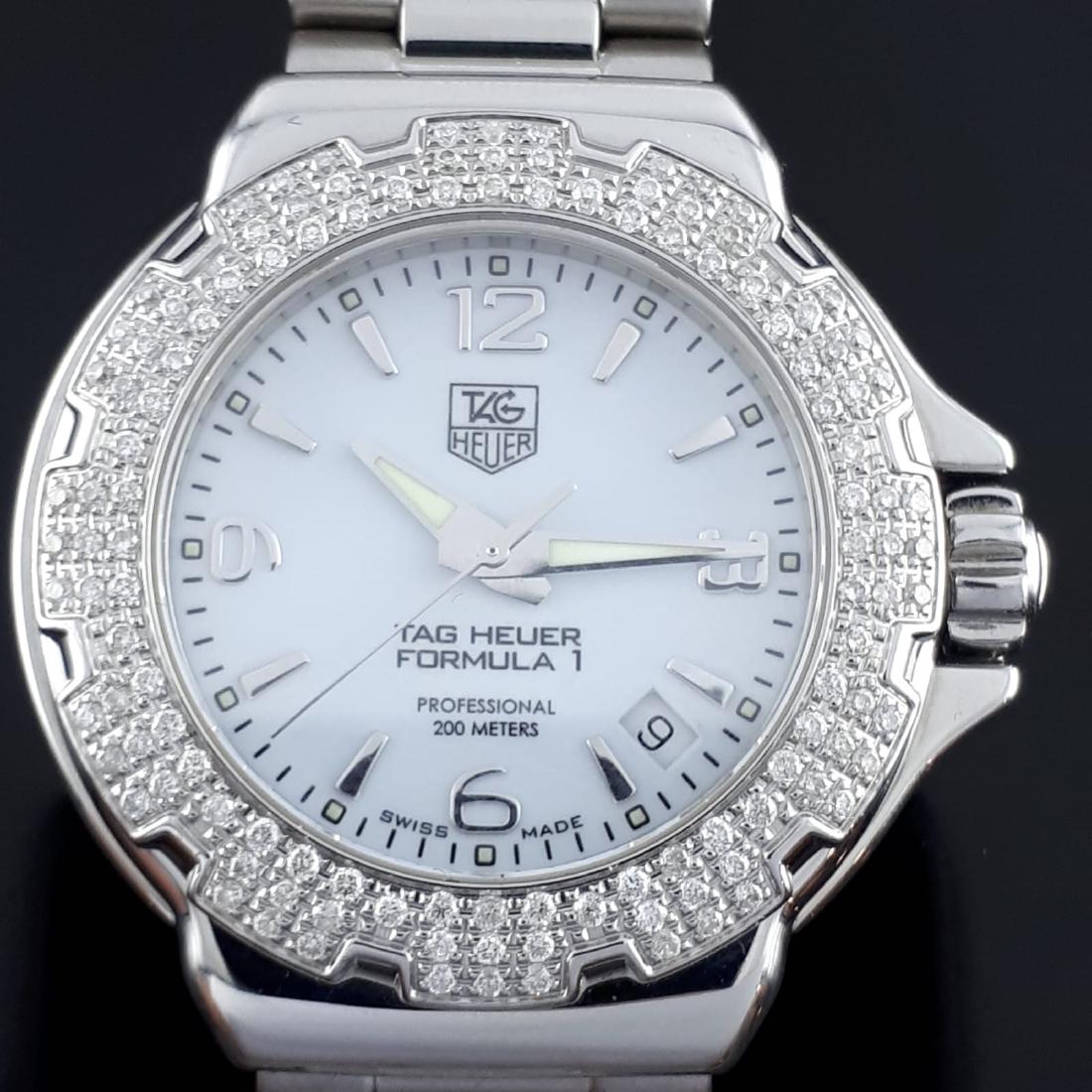 TAG Heuer - Formula I Diamonds - Women - 2011-present: Brand : TAG Heuer Model : Formula I with Diamonds Gender : Women Period : 2011-present Movement : Quartz Case Size : 1,40 in / 35mm Total Lenght : 7,28 in / 18.5cm Shipped by UPS/DHL with tracking num