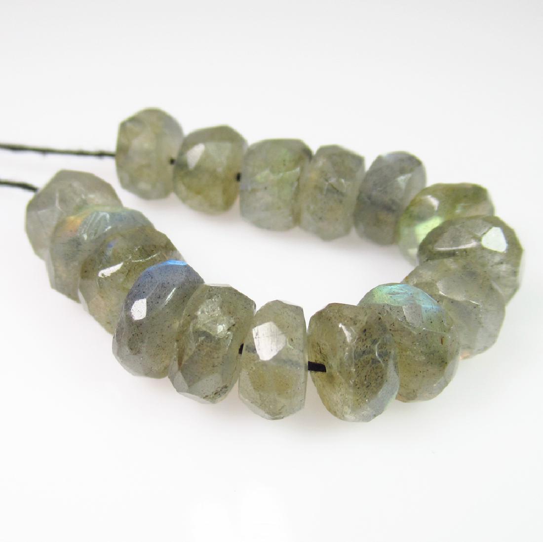 35.91 Ctw Natural 16 Labradorite Drilled Round Beads: No Reserve! Title: 35.91 Ctw Natural 16 Labradorite Drilled Round Beads Stone Clarity: Transparent Loose Gemstone: Labradorite Carat Weights: 35.91 Size/Dimensions: 7.80 to 8.10 mm / 16 PC's Drilled R