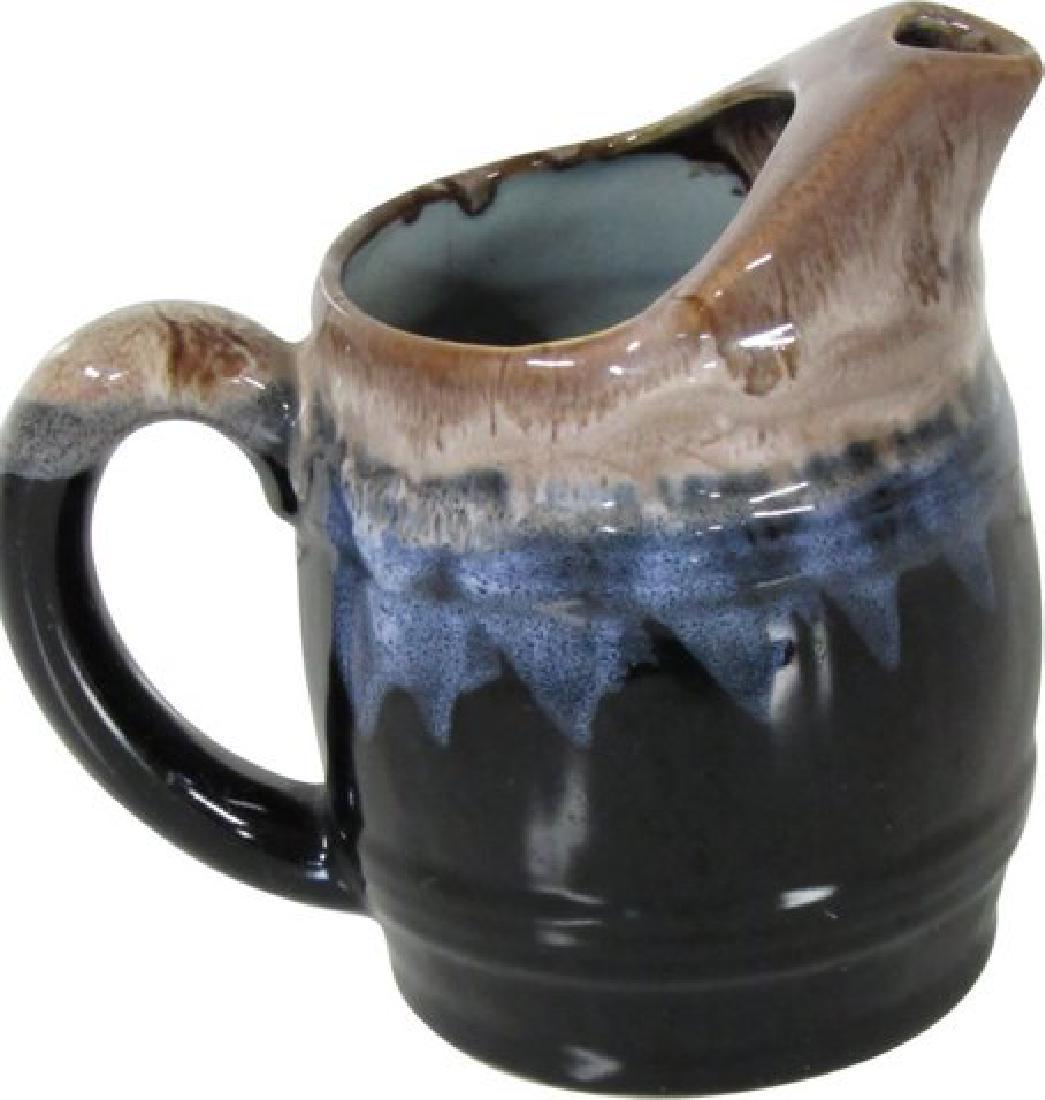 French Drip Glaze Carafe: 1960s French bistro carafe with shades of brown and cream dripping into hues of deep blue to black. Interior in pale aqua with brown and caramel drip glaze from spout. Numbered on base. 6" handle to s