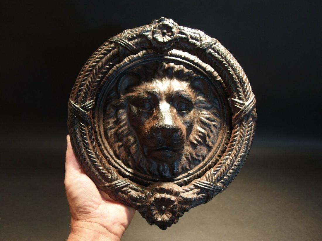 Cast Iron Lion Head Door Knocker Hardware: 11 1/2" Height x 10 1/4" Wide x 2 1/2" ExtensionGreat reproduction lion head door knocker cast from an antique. This piece weighs 8 lbs so you'll know when someone is knocking. It has a great authenti
