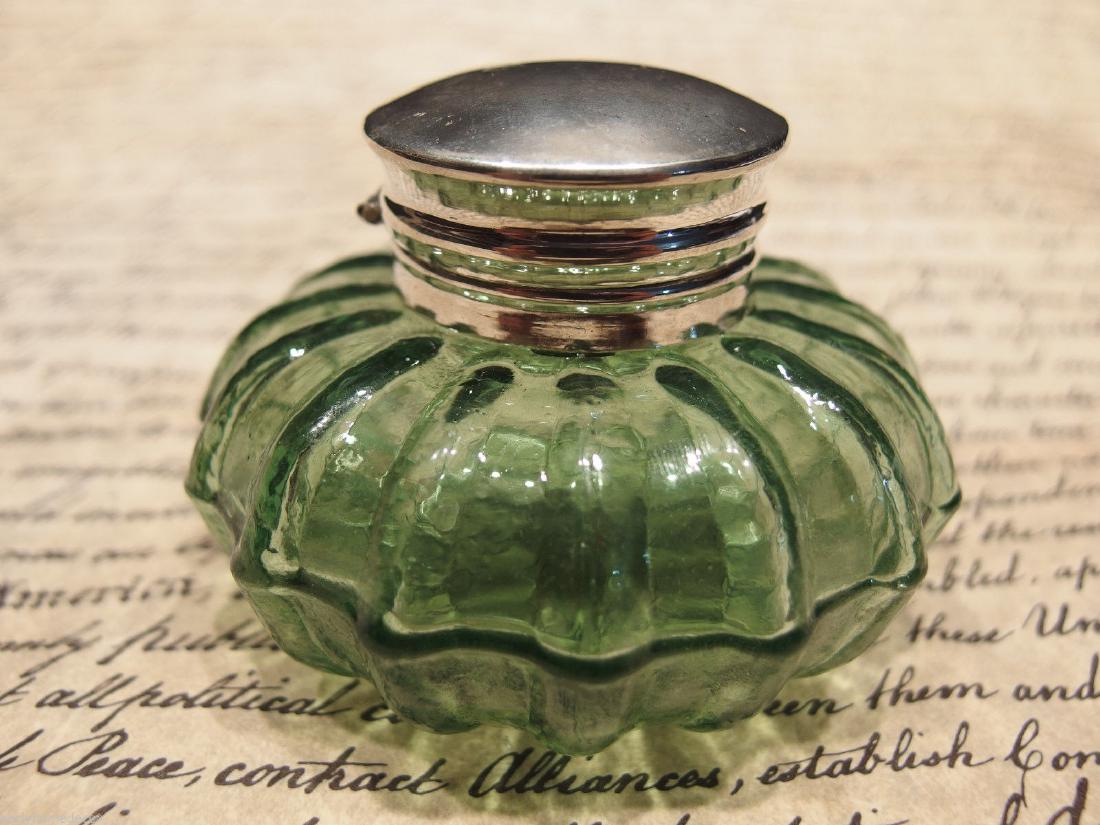 Round Green Glass Glass Inkwell Ink pot Bottle: Charming 2 1/4" High x 3 1/4" wide Charming Reproduction antique green glass inkwell. Very heavy thick glass each with charming subtle signs of being hand made. The hinged shiny lid is nickel plated b