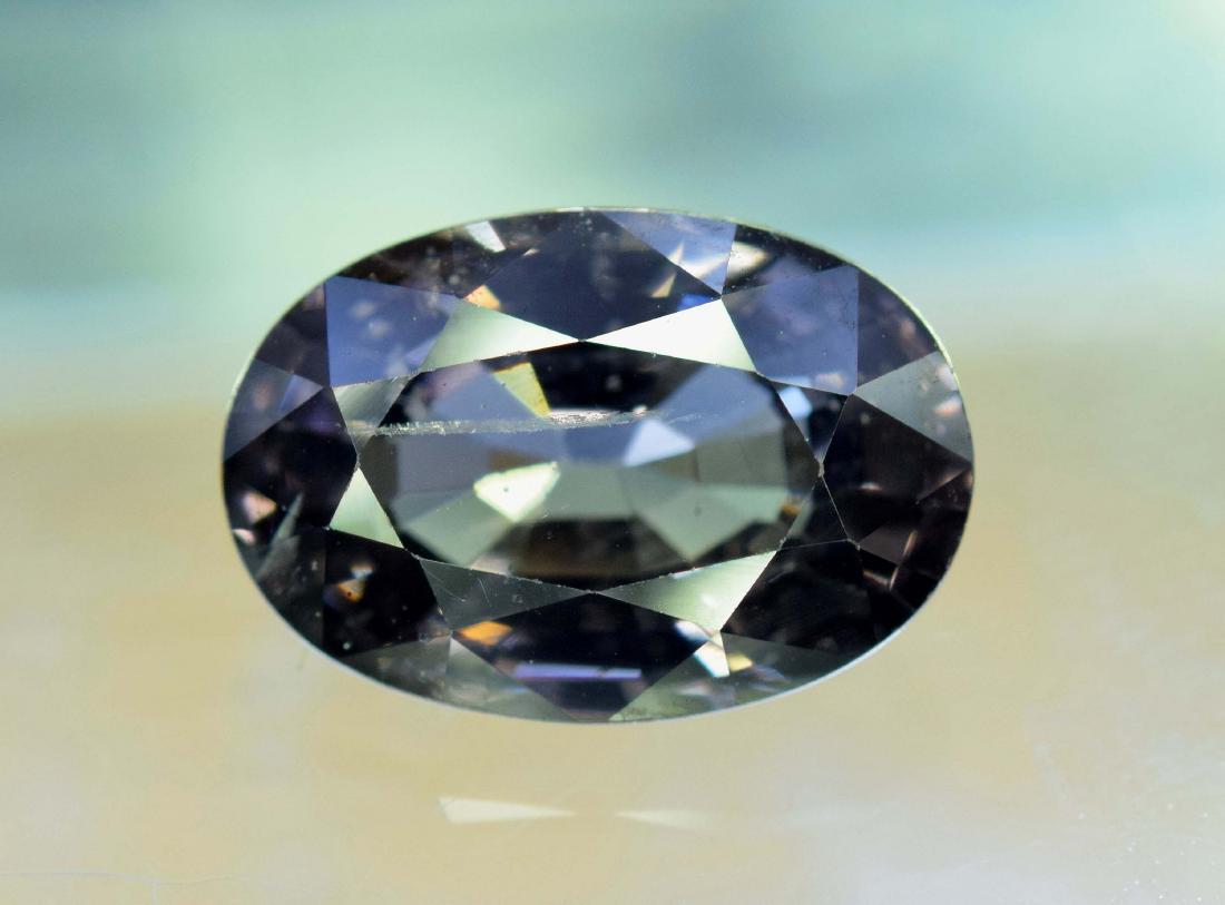 3.45 carats Oval Cut Top Grade Loop Clean Natural: 3.45 carats Oval Cut Top Grade Loop Clean Natural Charcoal Grey Spinel Loose Gemstone From Africa - weight : 3.45 Carats Dimensions : 11*7*5 mm Treatment : Natural Origin : Africa FREE DHL EXPRESS SHI