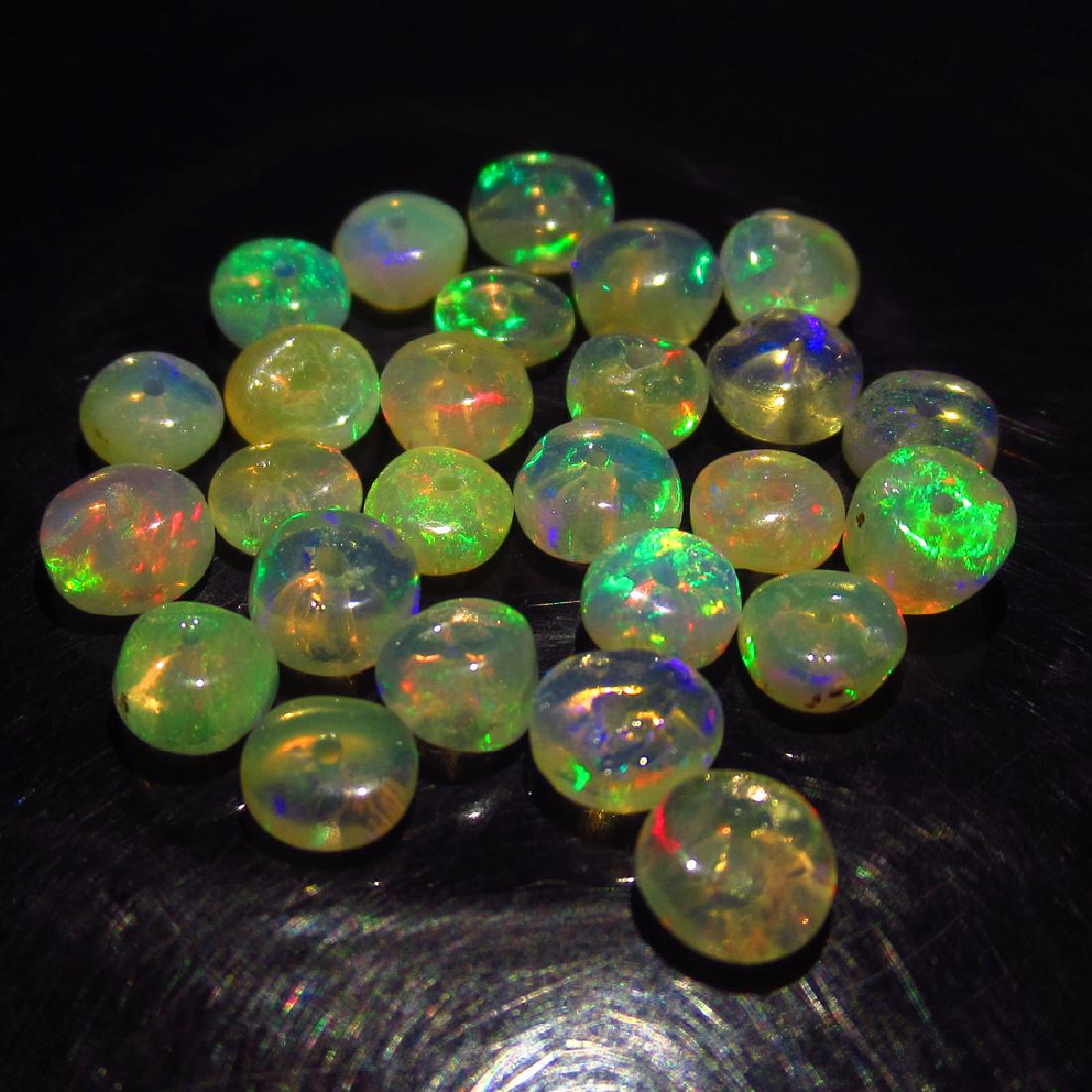 5.95 Ct Genuine 26 Drilled Round Fire Opal Beads: No Reserve! Title: 5.95 Ct Genuine 26 Drilled Round Fire Opal Beads Stone Clarity: Transparent Gemstones: Natural Opal Beads Carat Weights: 5.95 Size/Dimensions: 4.00 to 4.70 mm / 26 PC's Additional I