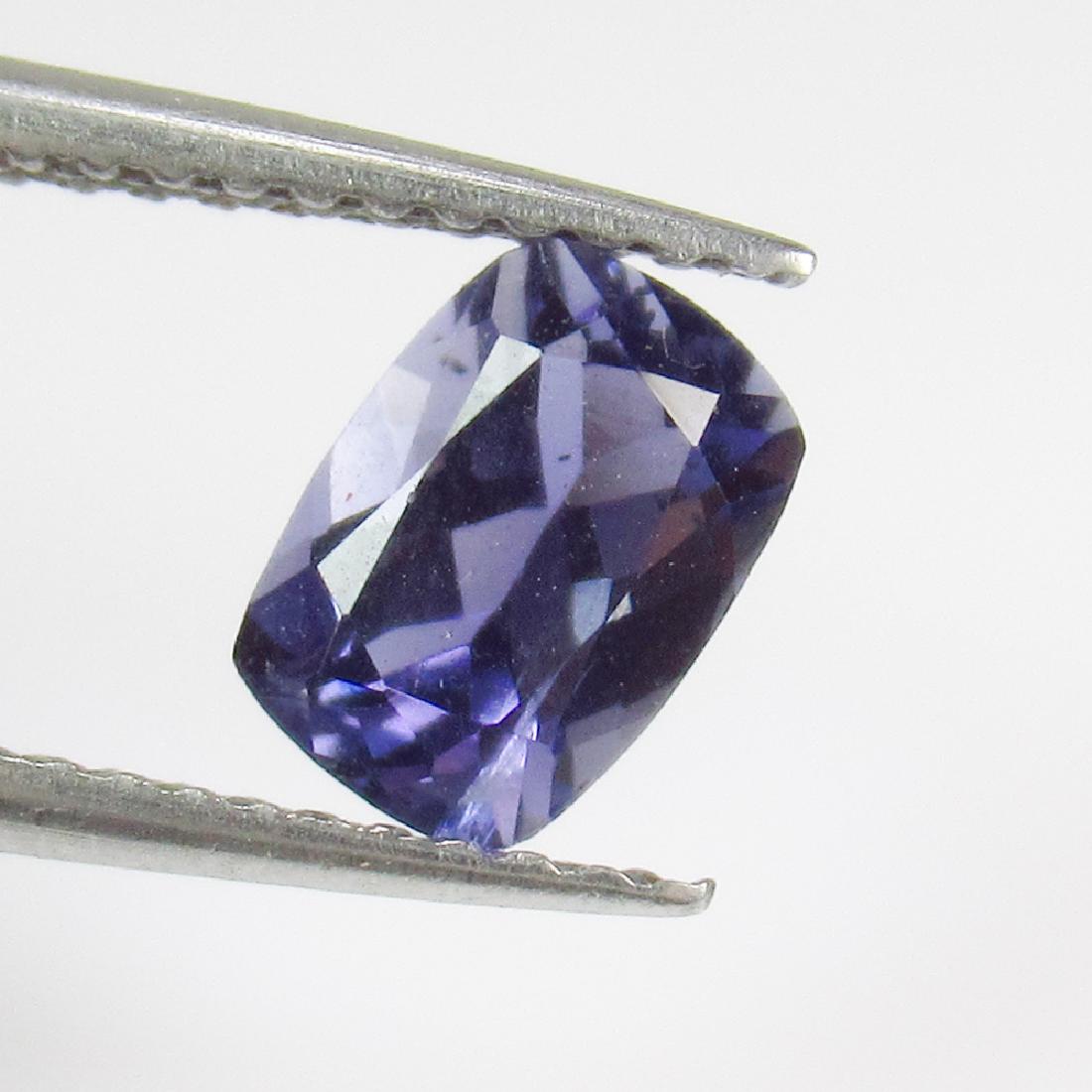 0.77 Ctw Natural Iolite 7X5 mm Cushion Cut: No Reserve! Title: 0.77 Ctw Natural Iolite 7X5 mm Cushion Cut Stone Clarity: VVS Gemstones: Iolite Carat Weights: 0.77 Size/Dimensions: 7.00 x 5.00 x 3.80 mm Additional Information: Top Quality Luster