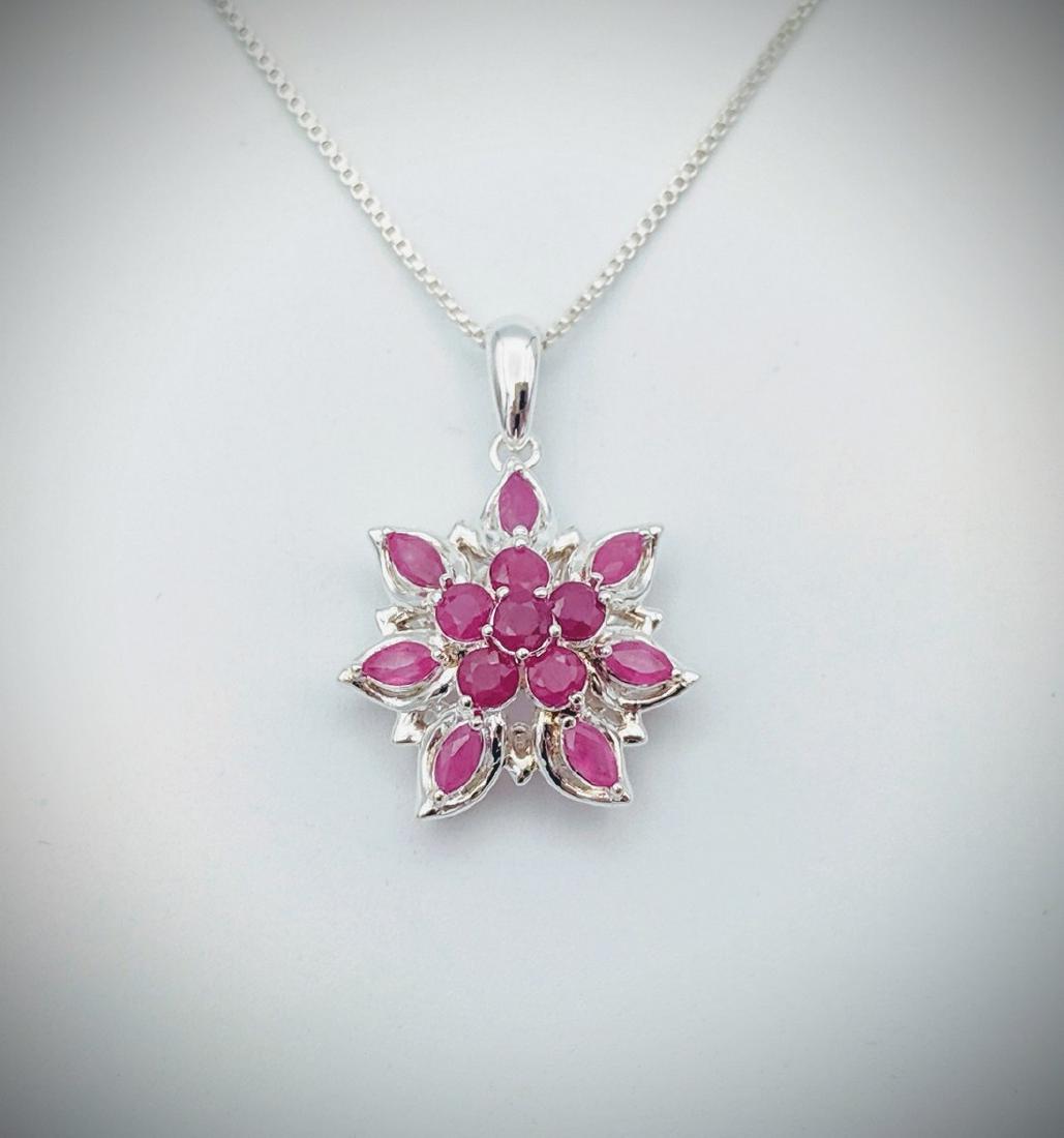 Italian Sterling Silver Necklace w Raw Rubies Pendant: Title: Italian Sterling Silver Necklace w Raw Rubies Pendant Brand: Jean Lin Collection Metal Purity: 925 Sterling Silver Gemstones: Raw Rubies Carat Weights: Pendant has 6 Round Rubies at 2.75mm (0.0