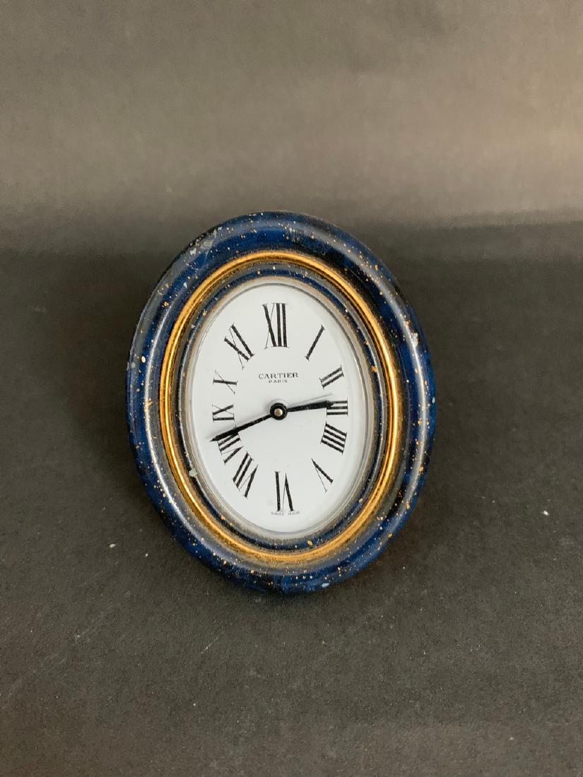 Cartier Lapis Desk Clock: Title: Cartier Lapis Desk Clock Origin: France Date/Period: 80’s Materials: Lapis and Bronze Size: 4x3 Small Lapis Clock from Cartier with the signature blue sapphire Reserve: $80.00 Shipping: